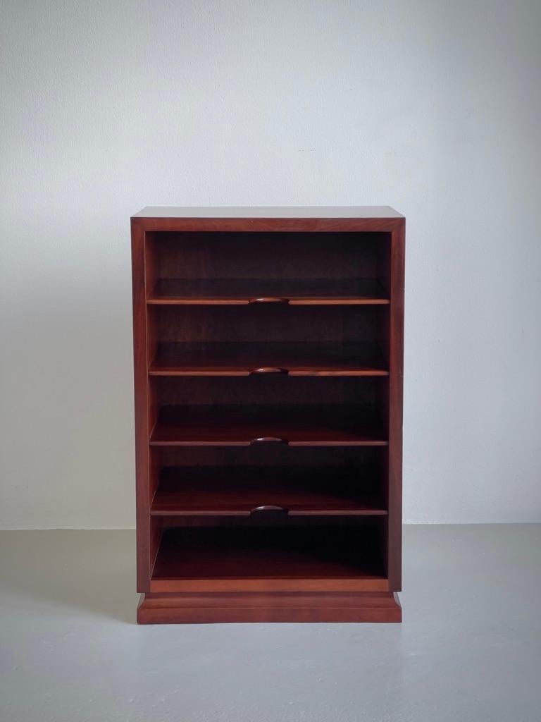 This 1930s Danish cabinetmaker magazine holder is a refined example of functional design elevated through masterful craftsmanship. Impeccably constructed in richly lacquered dark hardwood, the piece exudes a quiet sophistication, characteristic of