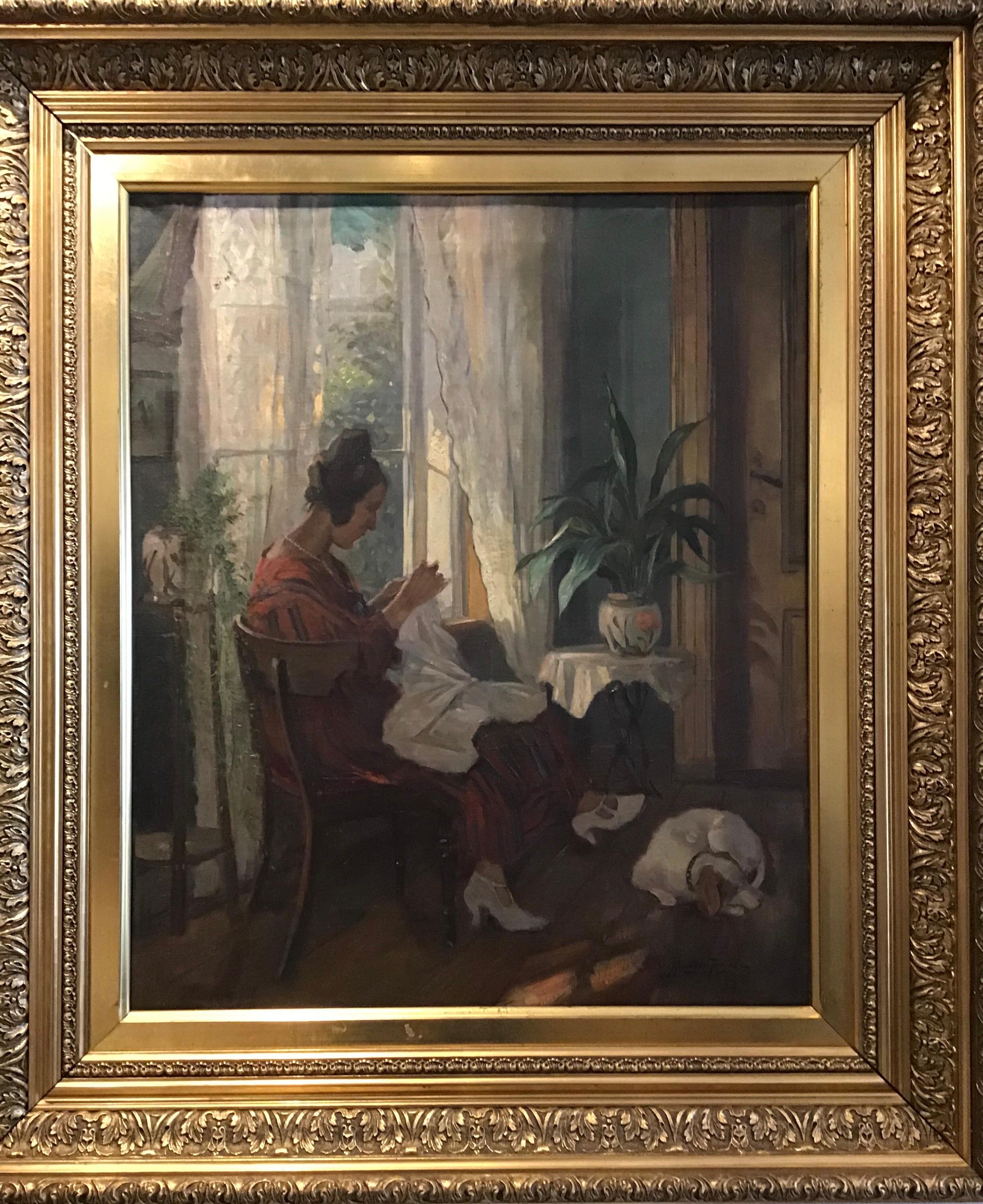 A framed oil painting on canvas. Signed by danish artist Carl Horning-Jensen.

This charming painting which is believed to have been painted during the 1930s, features an elegant lady seated by a window, perhaps in her front parlour sewing. She is