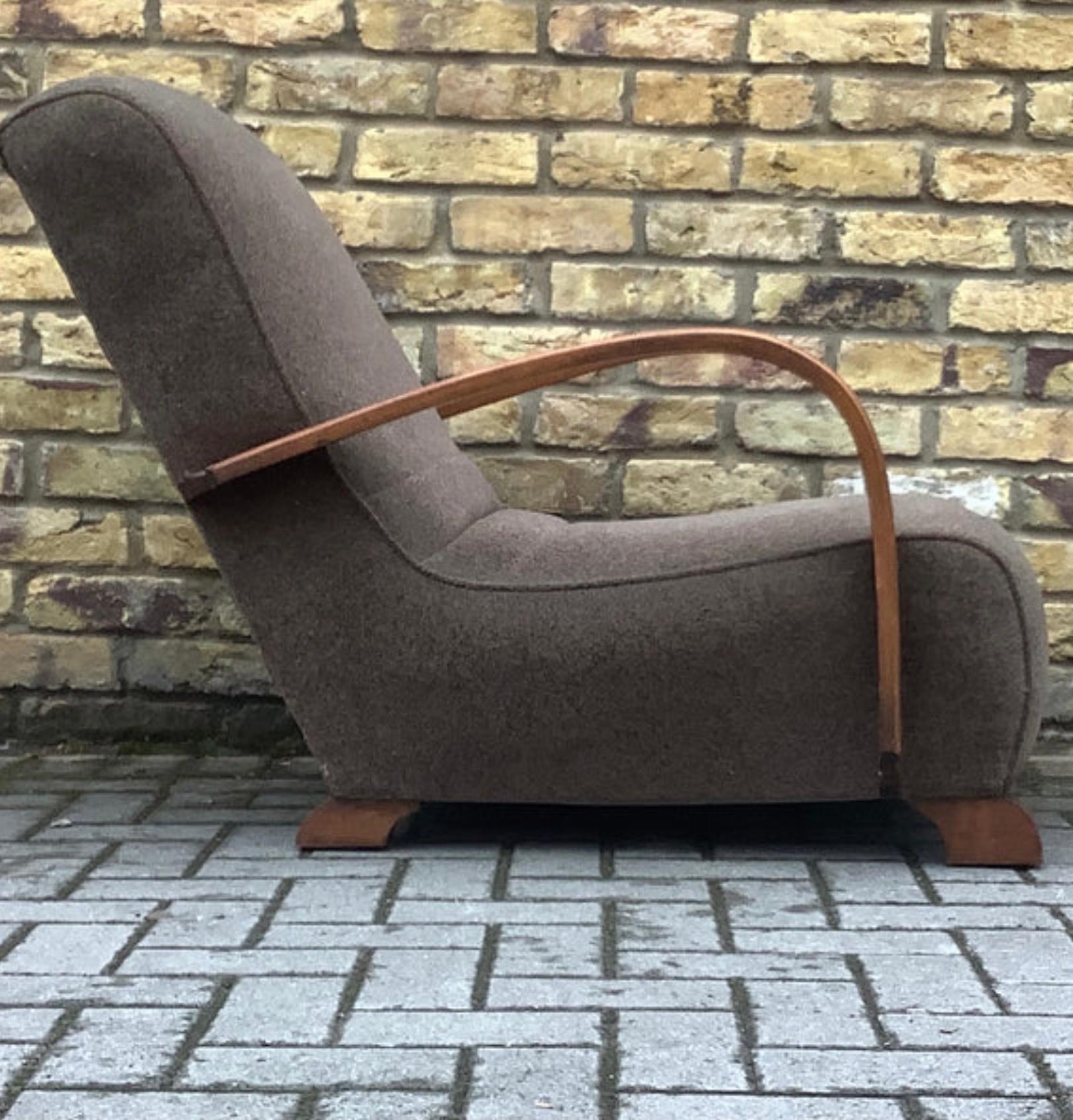 Deco armchair fully reupholstered in soft brown fabric with steamed bent armchair in the style of the Czech Republic designer Jindrich Halabala
Super low and comfortable.