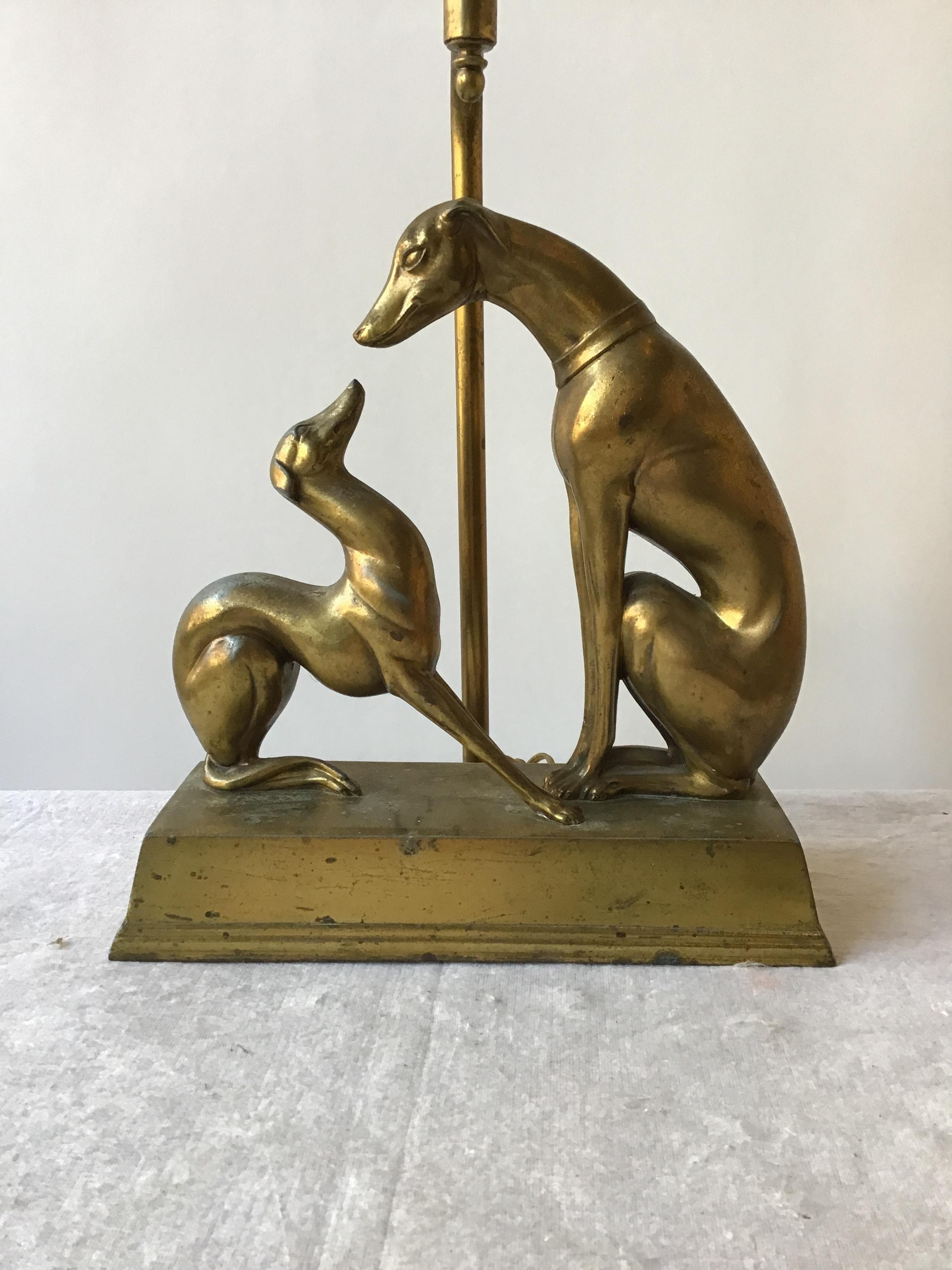 1930s deco Greyhound lamp. Brass-plated over metal. Areas of wear on lamp.