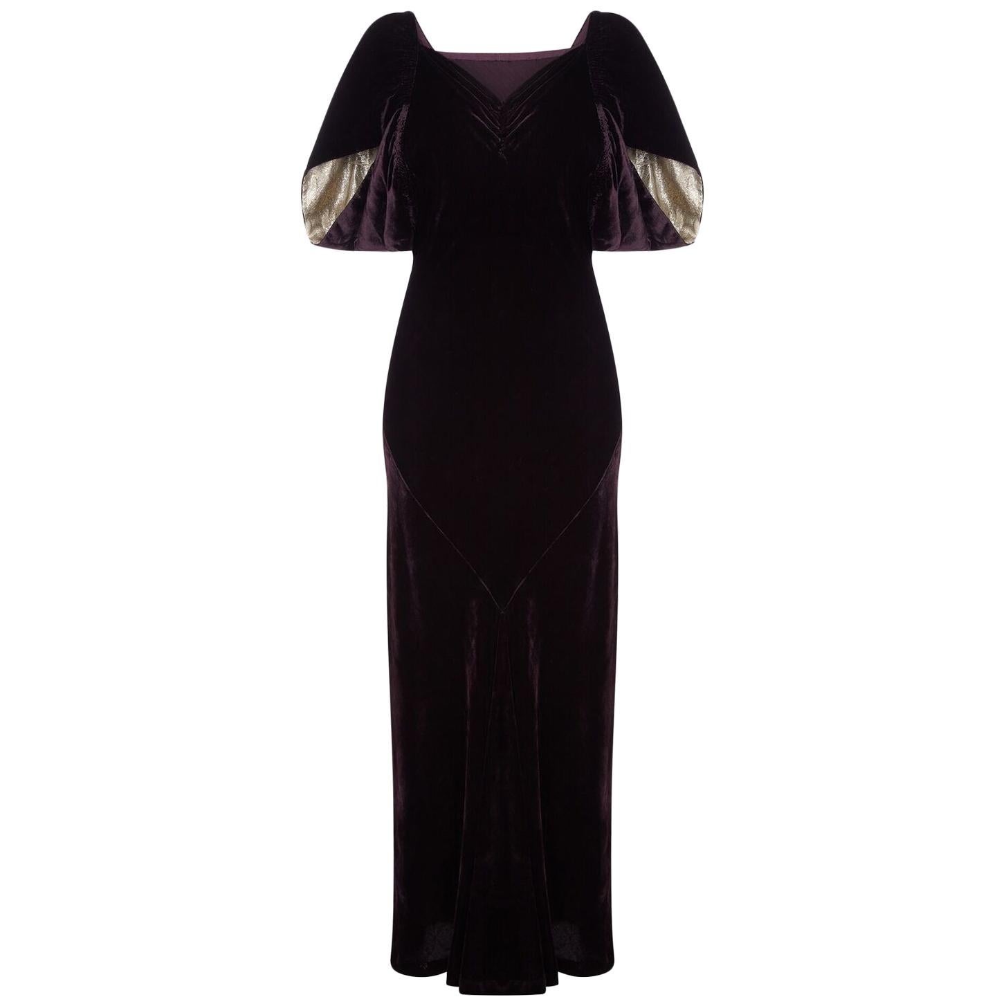 black and gold cape dress