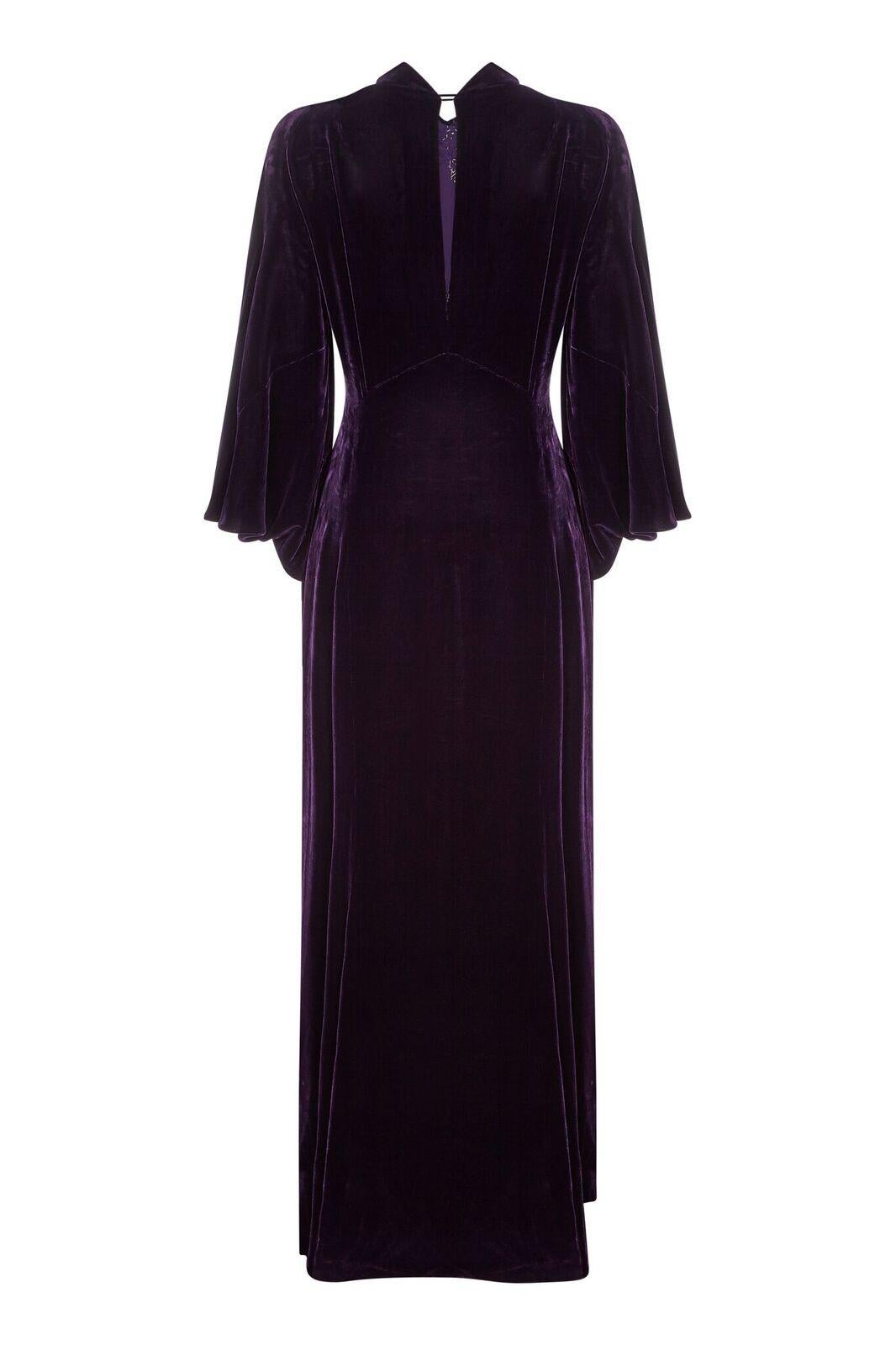 This incredible 1930s gown in deep purple velvet with diamanté embellishment is tailored skilfully at the waist to fit beautifully over the curve of the hip, falling into a dramatic floor sweeping skirt with a slight train at the reverse. The long