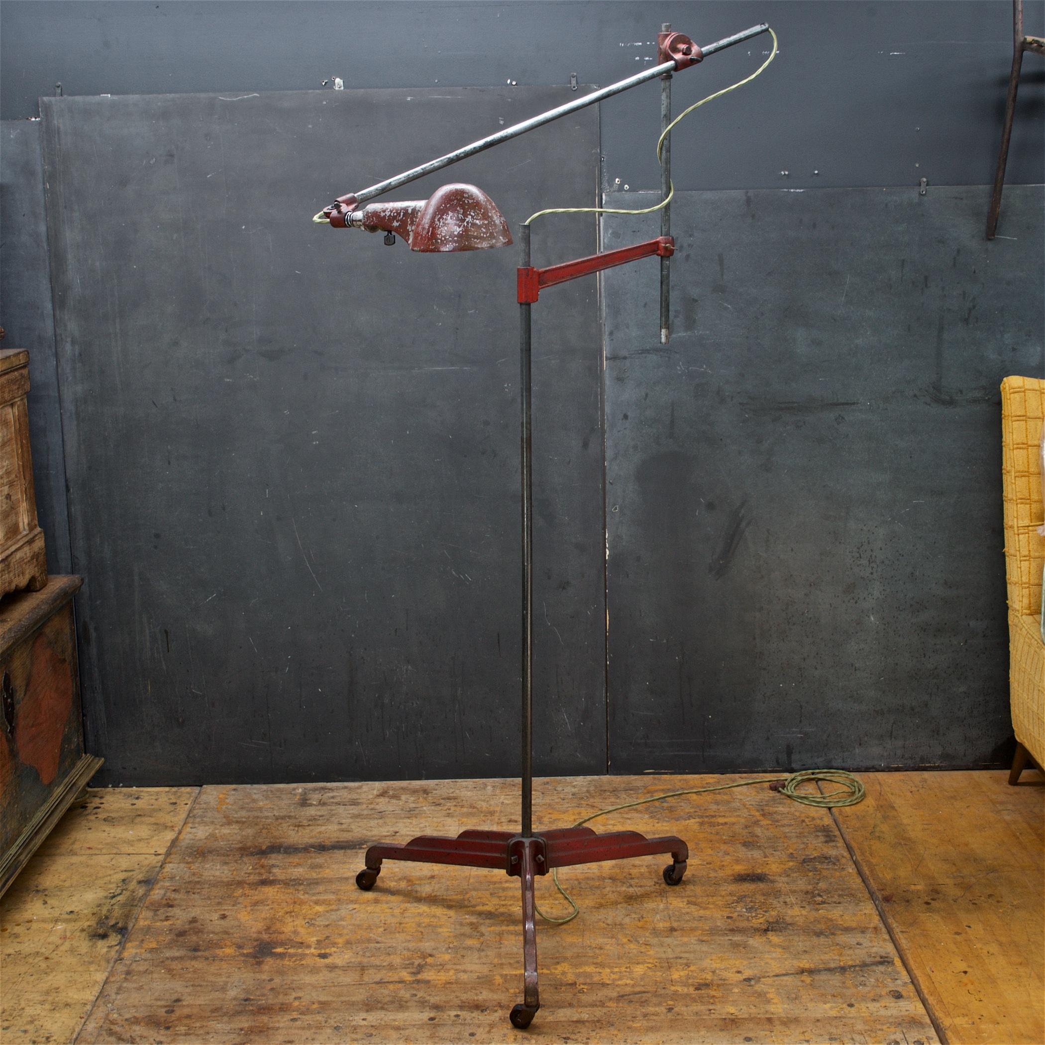 Highly adjustable lamp, a couple thumbscrews, articulate joint, a flathead screw, etc. to set lamp in any position. In the first image lamp is set at roughly 6.5 Feet by 3.5 Feet wide, and base is 27 inches deep.

Designed and patented by William