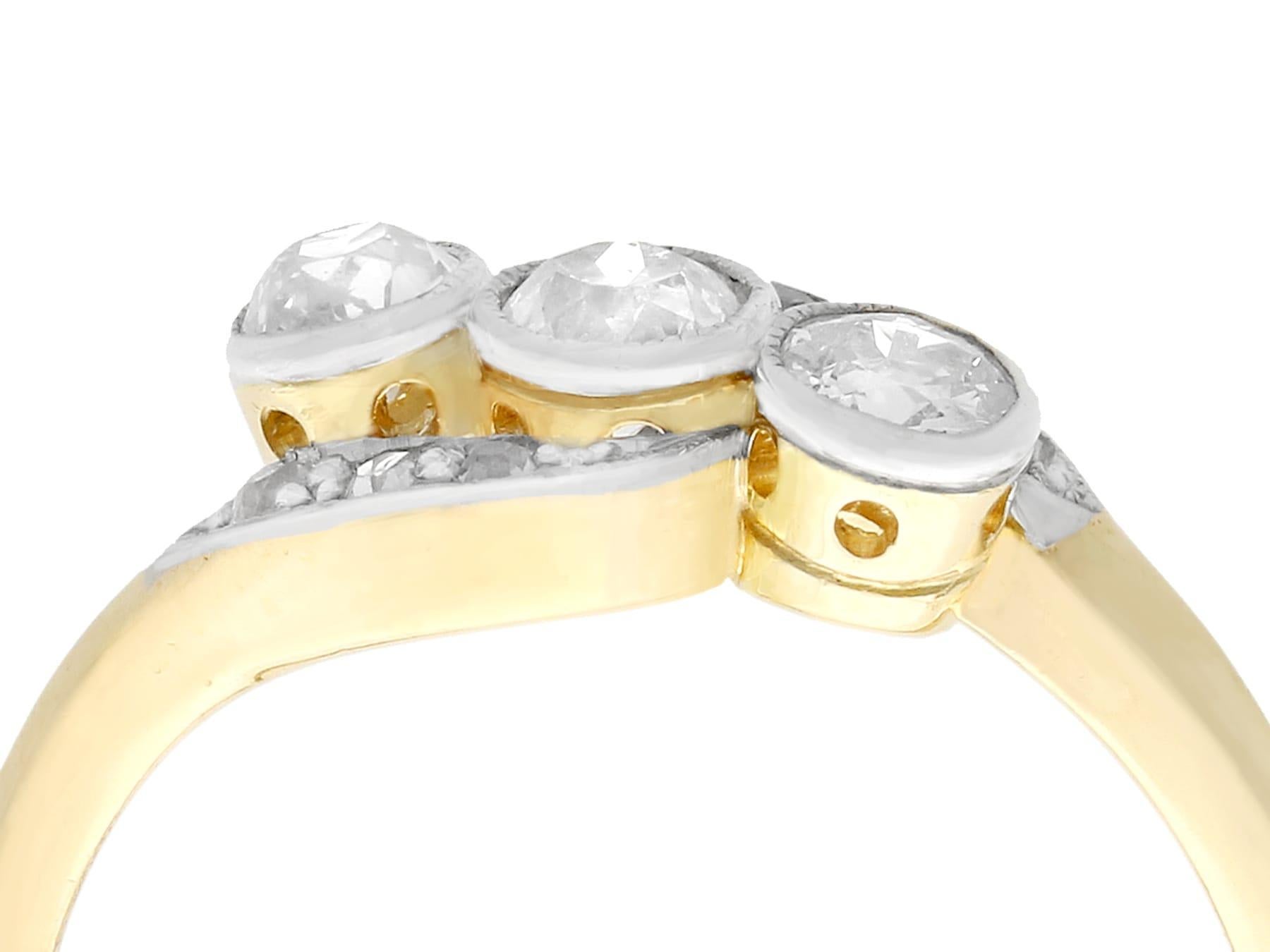 An impressive antique 1930s 0.57 carat diamond and 18 karat yellow gold, 18 karat white gold set twist style trilogy ring; part of our diverse antique estate jewelry collections.

This fine and impressive 1930s diamond ring has been crafted in 18k