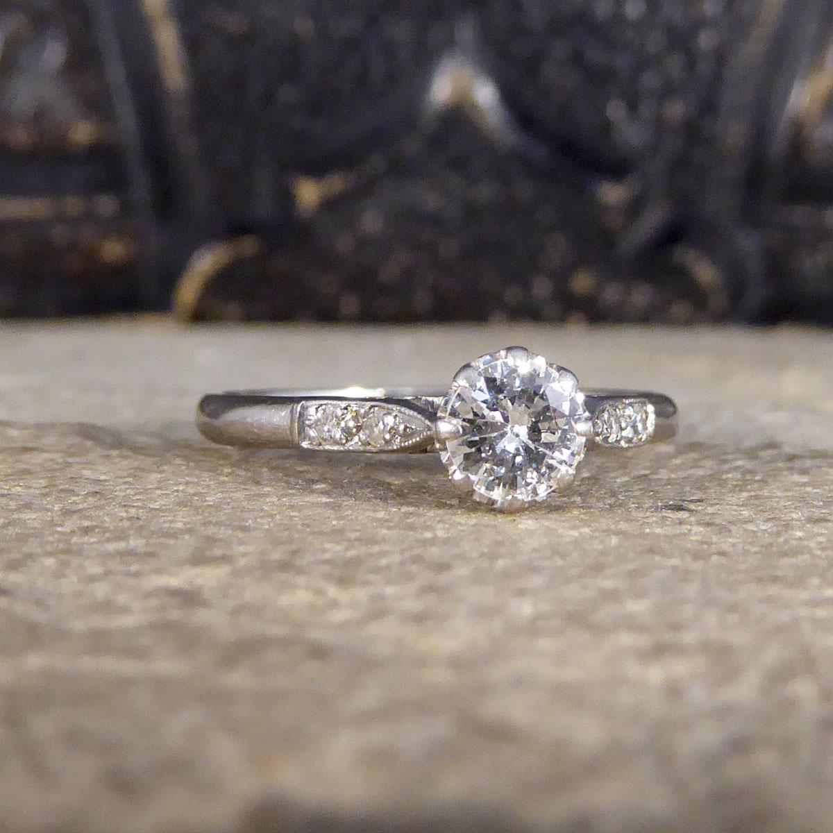 This gorgeous Diamond ring that was made in the 1930's. Such a good quality example of an Art Deco solitaire ring that has a 0.30ct Diamond in the centre with two further Diamonds set in to each of the tapered shoulders. It would make a lovely Art