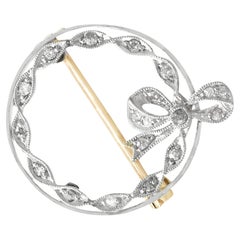 1930s Diamond Yellow Gold Platinum Set Bow Brooch