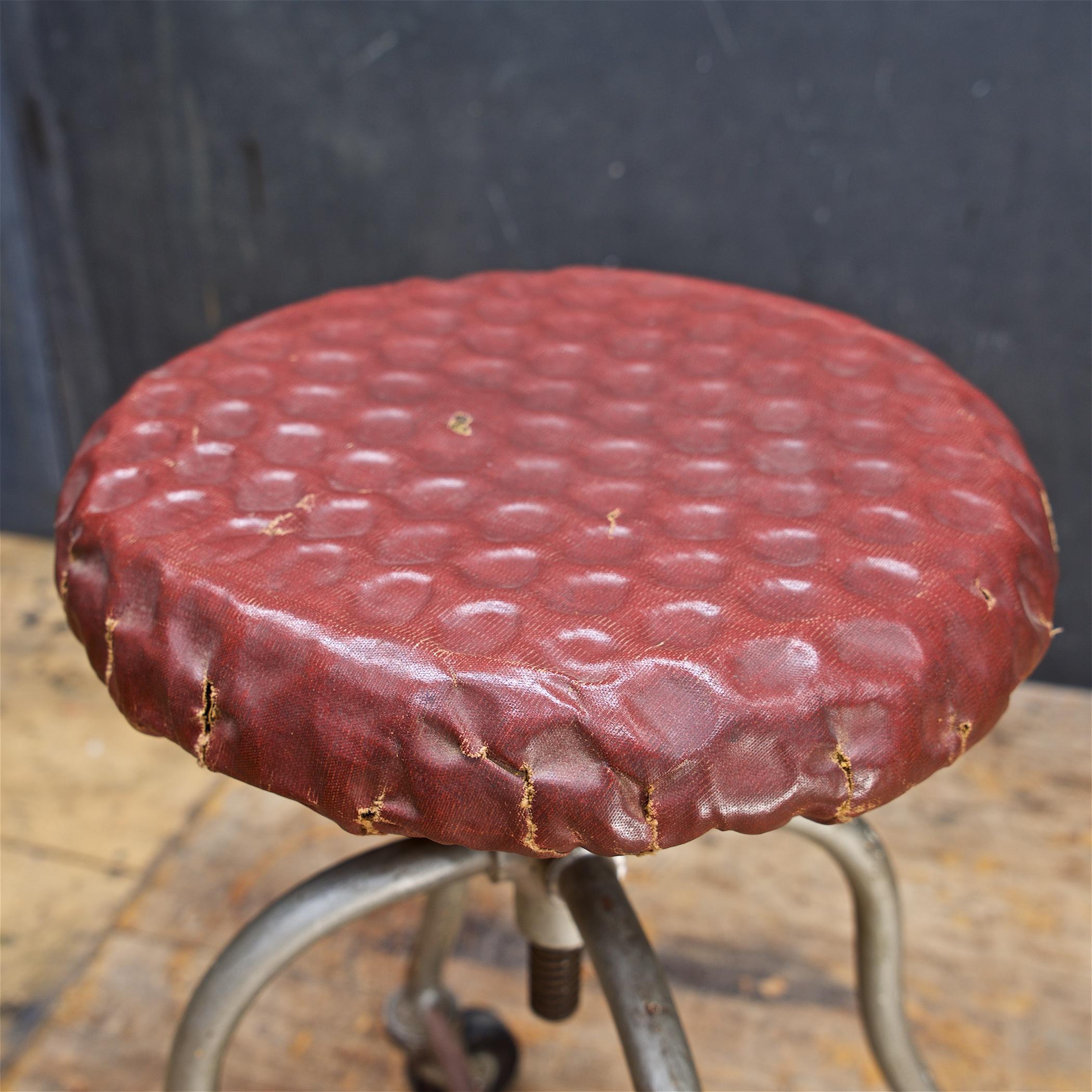 1930s Dimpled Industrial Artists Painters Sculptors Stool Vintage Iron Wheels In Distressed Condition For Sale In Hyattsville, MD