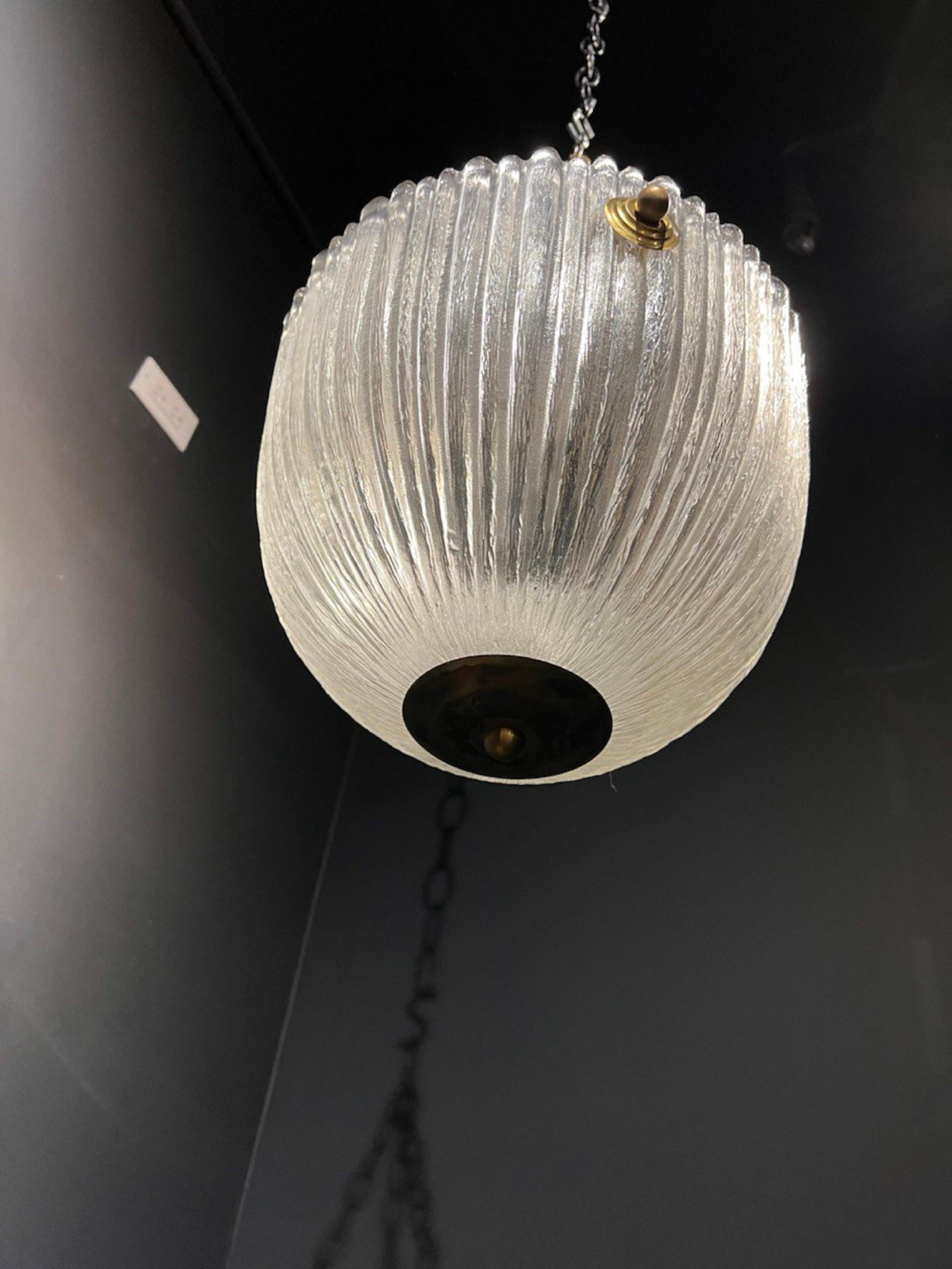 A circa 1930 French molded glass light fixture with interior lights