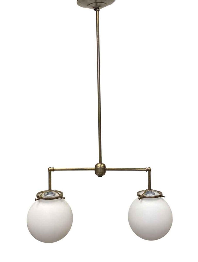American 1930s Double Arm Milk Opaline Glass Pendant Globe Fixture with Brass hardware For Sale