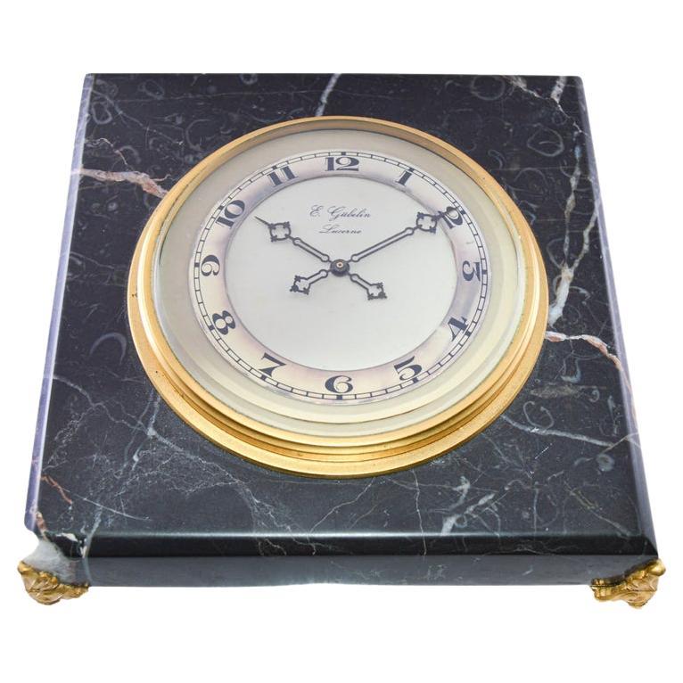 FACTORY / HOUSE: E. Gubelin Watch Company
STYLE / REFERENCE: Table Clock
METAL / MATERIAL: Stone
CIRCA / YEAR: 1930's
DIMENSIONS: 5