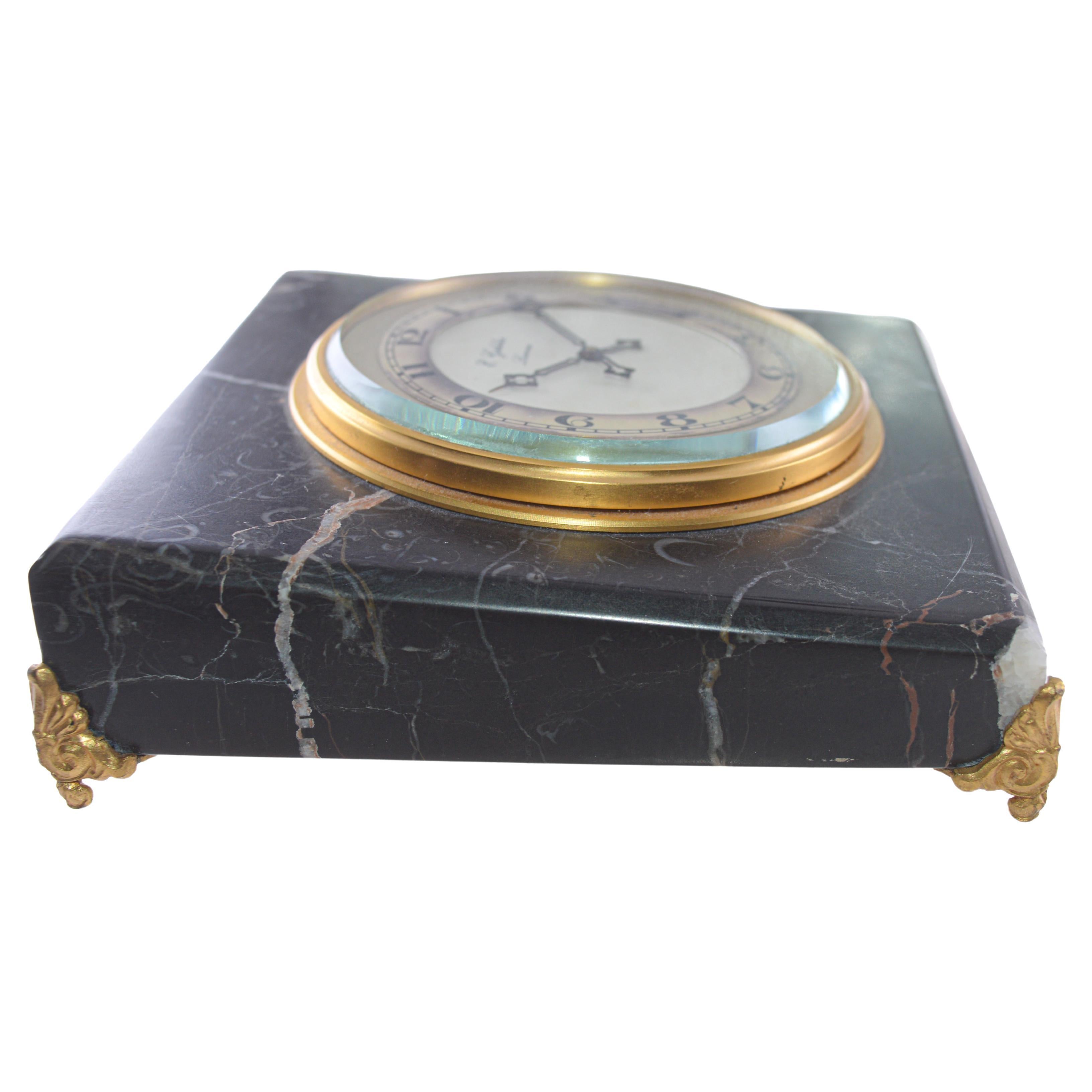 FACTORY / HOUSE: E. Gubelin Watch Company
STYLE / REFERENCE: Table Clock / Art Deco
METAL / MATERIAL: Stone / Bronze 
CIRCA / YEAR: 1930's
DIMENSIONS: 5