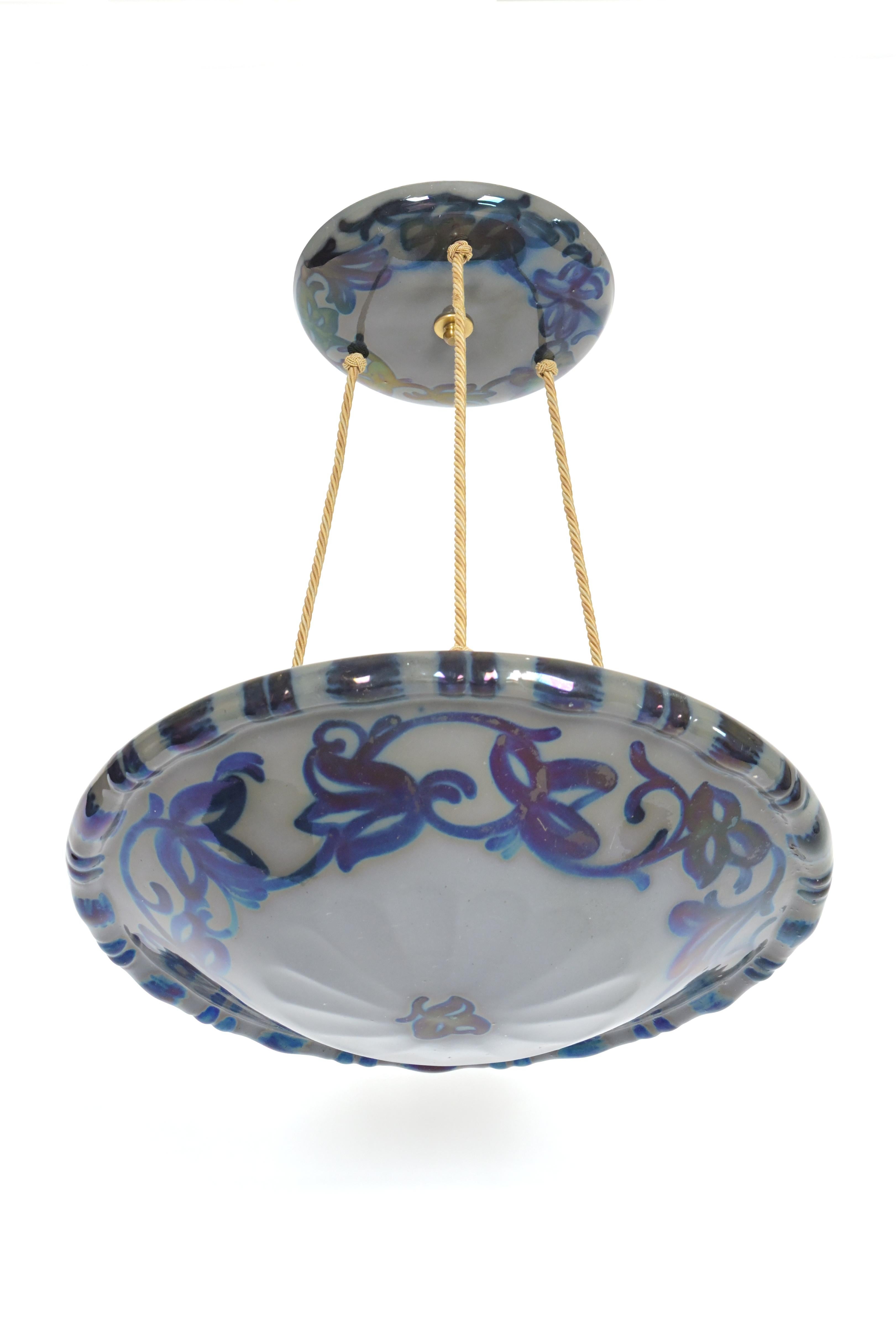 A two disc pendant light designed by Swedish artist Edgar Böckman (1890-1981). Made of two earthenware discs with detailed painted blue floral patterns and striping suspended on three silk wire rope cords. circa 1930s. Newly Wired. Three Edison