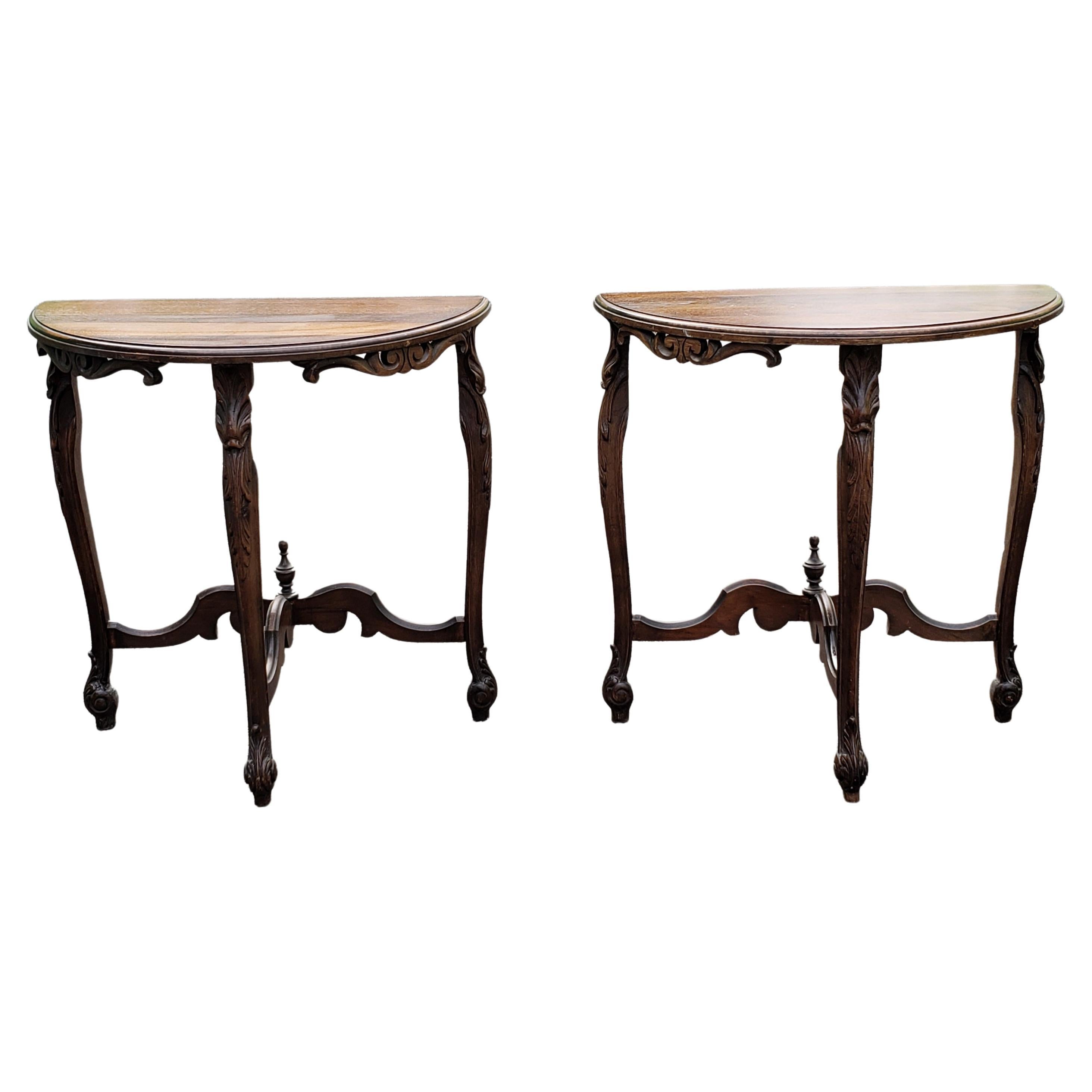 Pair of Edwardian demi-lune side tables that can joined to make a round tea table or gueridon. Beautiful leg carvings and stretchers. Solid construction.
Measures 24