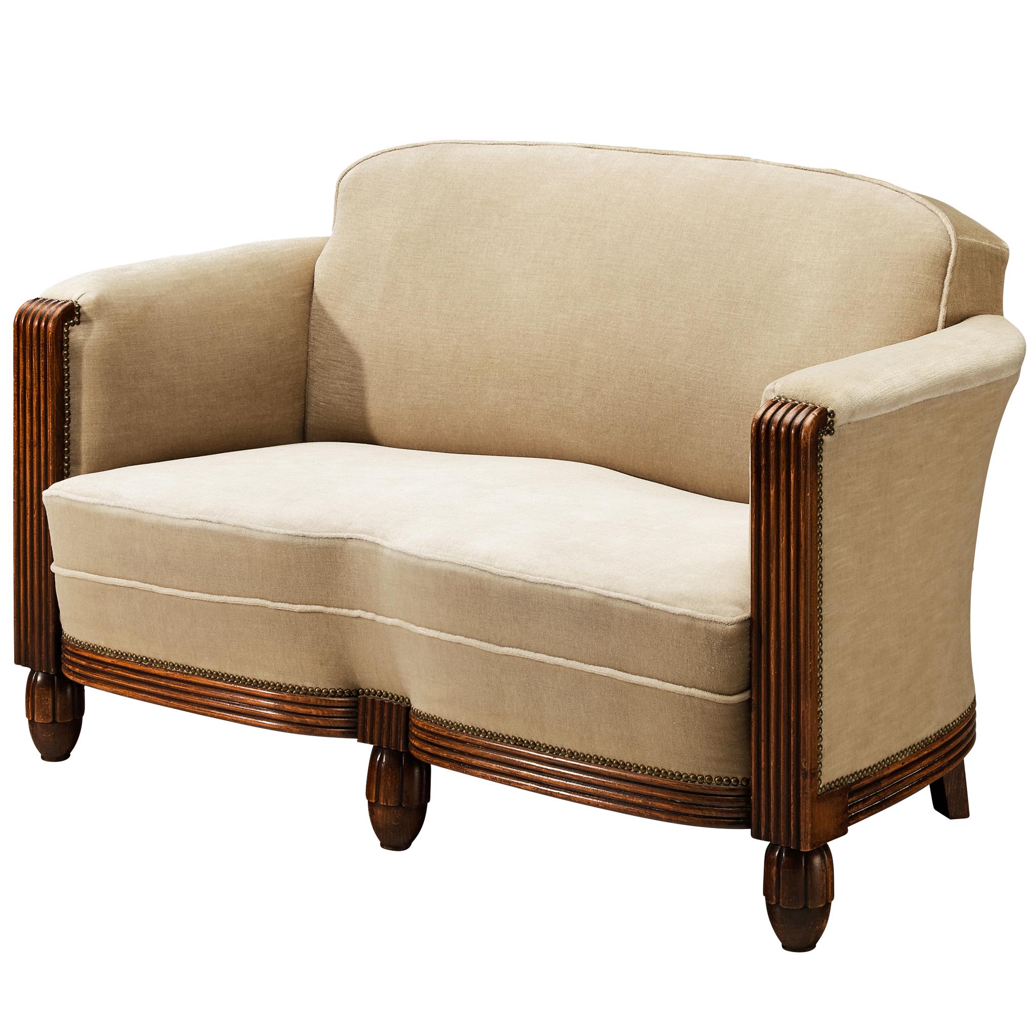 What was a sofa called in 1900?