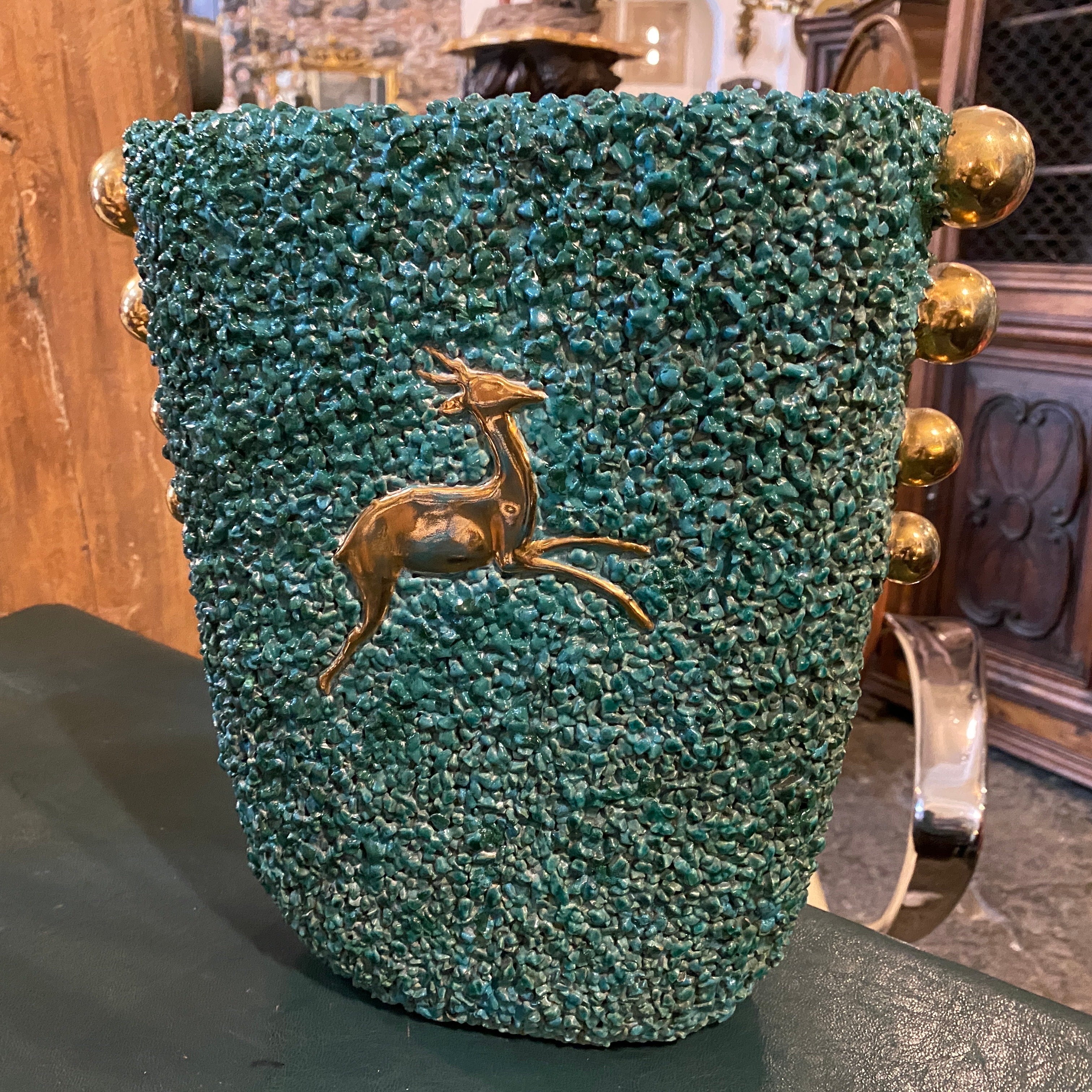 An Art Deco green and gold ceramic vase hand-crafted in Italy 1930s by Gabriele Bicchioni. Lathe forming, semi-matte green glaze on a rough surface obtained with application of grit spheres decorated in gold on the sides. the vase it's in very good