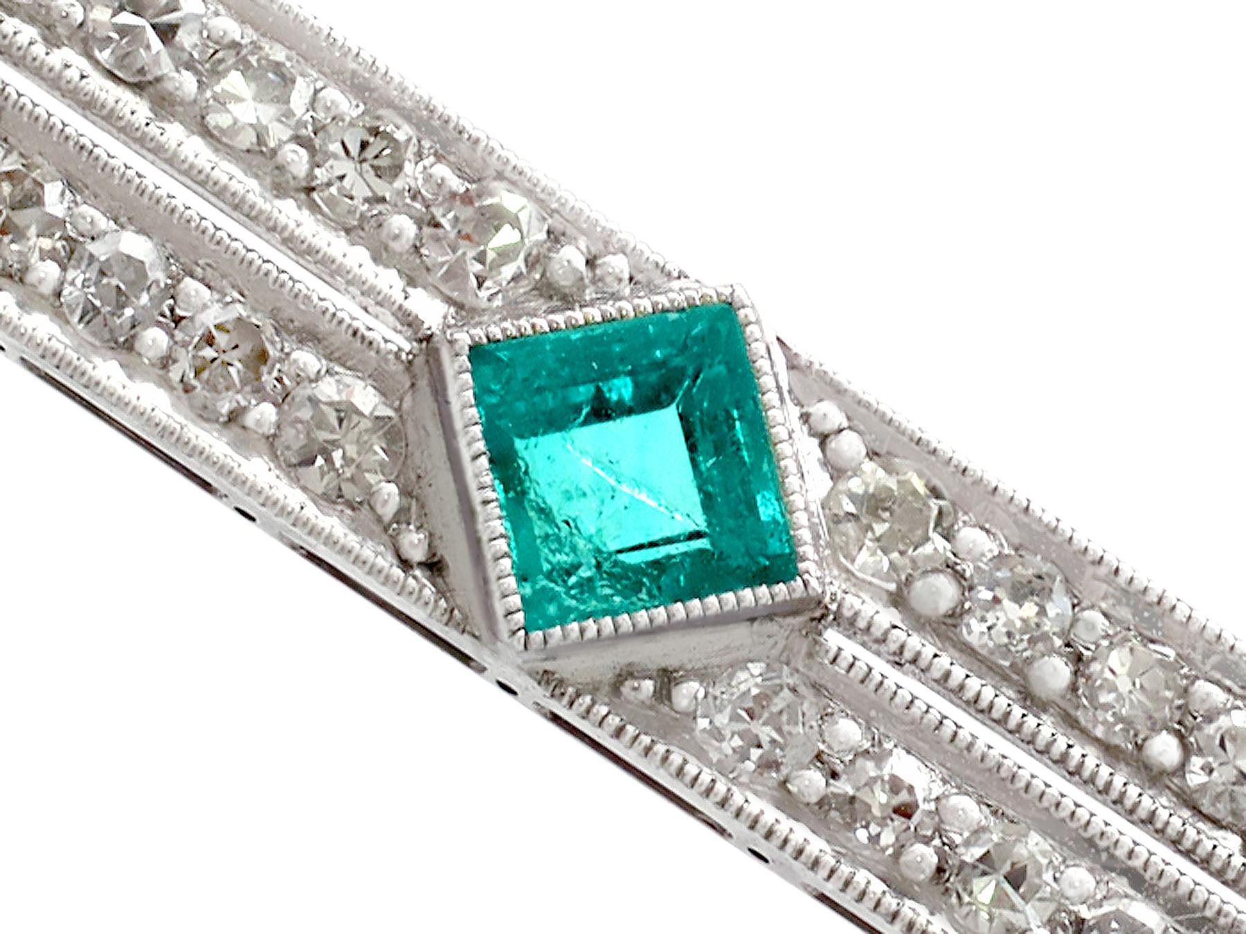 A stunning, fine and impressive antique Art Deco style 0.48 carat emerald and 1.29 carat diamond, platinum brooch; part of our antique jewelry and estate jewelry collections.

This stunning antique diamond and emerald brooch has been crafted in