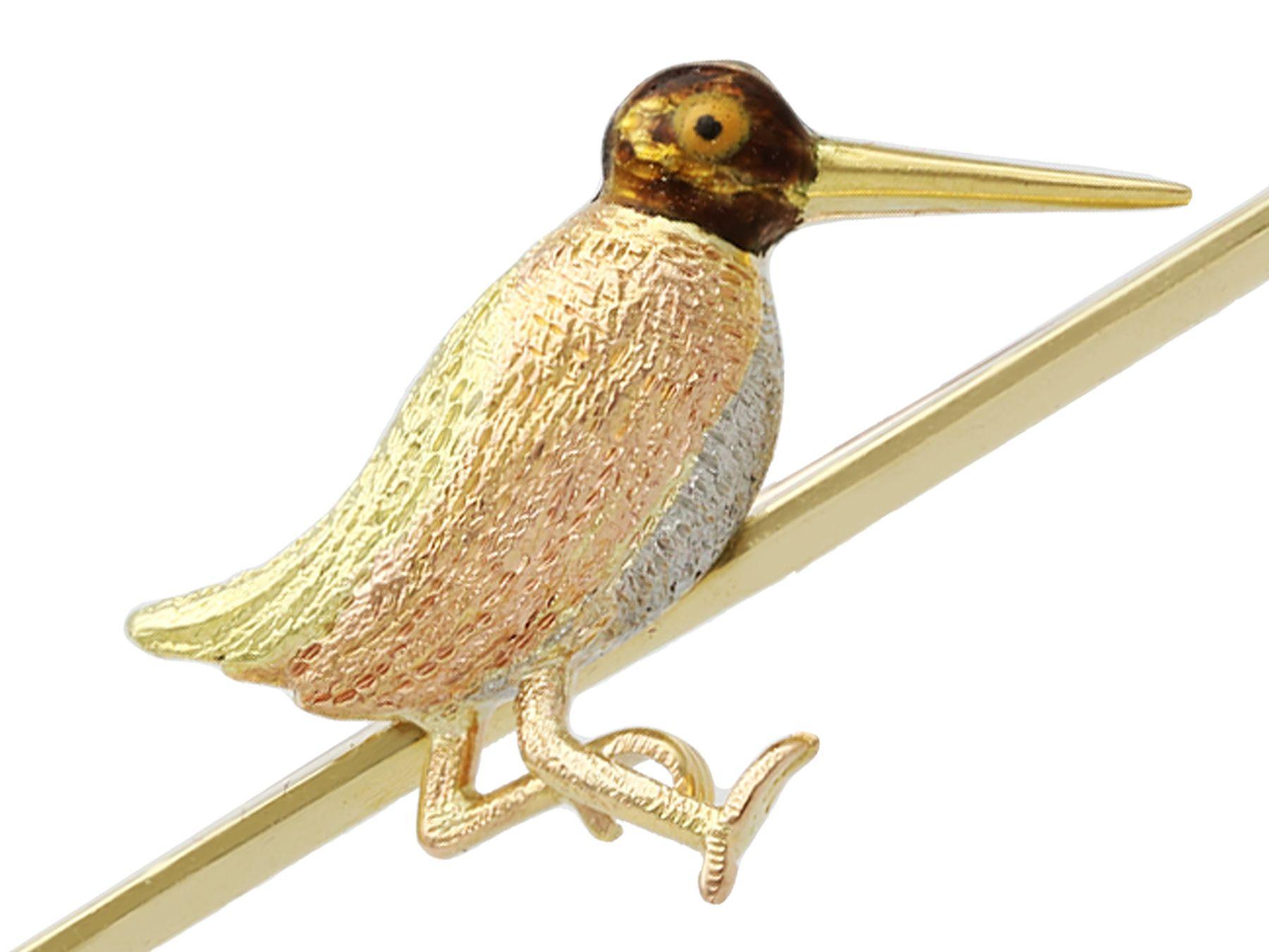 An impressive antique 1930s enamel, platinum, 15 karat rose and yellow gold bird brooch in the form of a snipe; part of our diverse enamel jewelry and estate jewelry collections.

This fine and impressive antique brooch has been crafted in 15k
