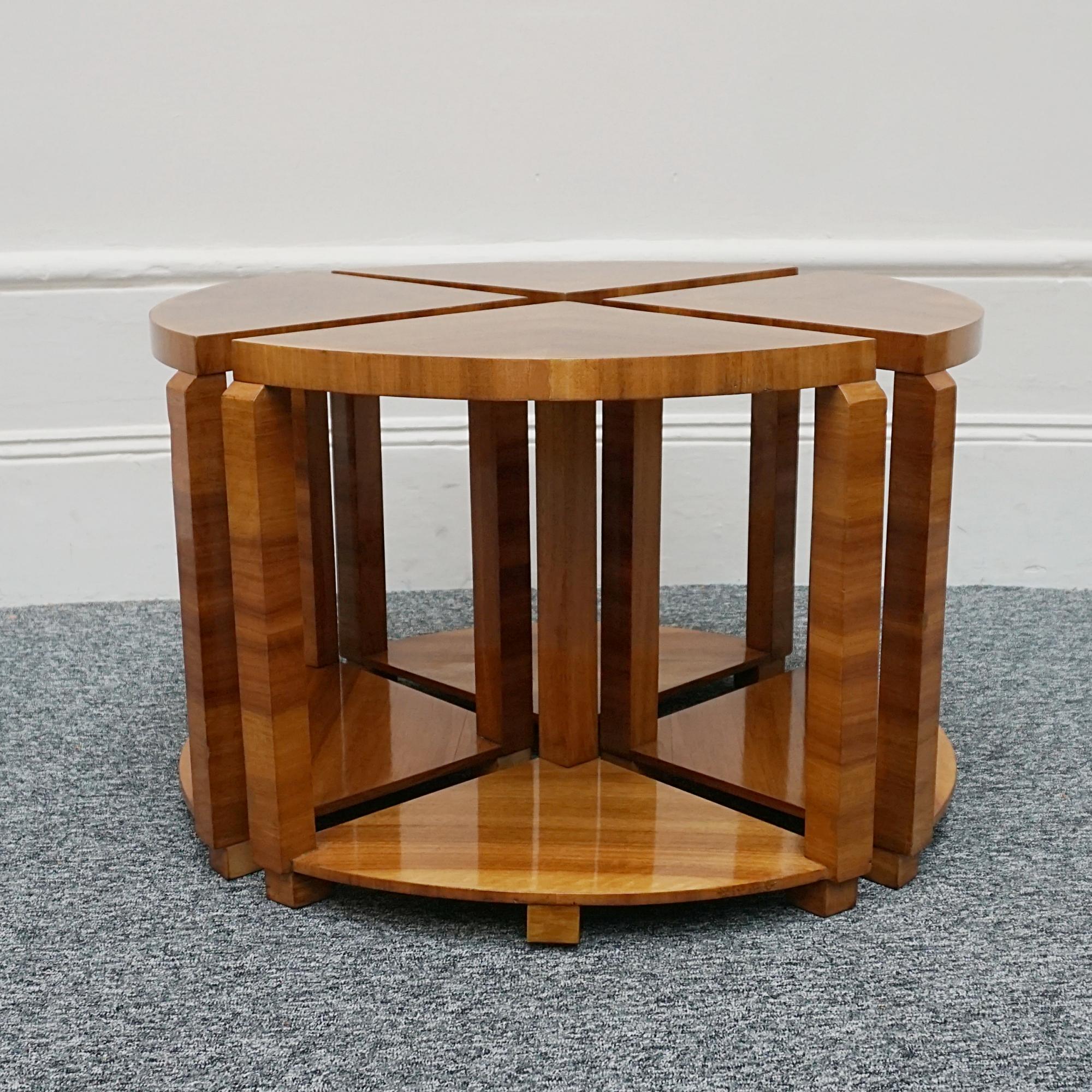 An Art Deco nest of tables. Figured walnut throughout with four pull out side tables and circular glass top (not pictured). 

Dimensions: H 51cm W/D: 76cm

Origin:  English

Date: Circa 1935

Item Number: 1011230

All of our furniture is extensively