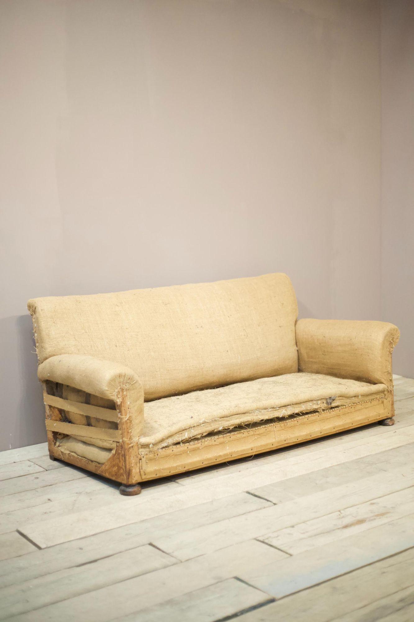 This is a superb quality 1920s 1930s English country house sofa. It is the ever popular classic square back design with scroll arms. Elegant shape and fits well into a huge number of interiors. It has always had a fixed seat but we can add seat