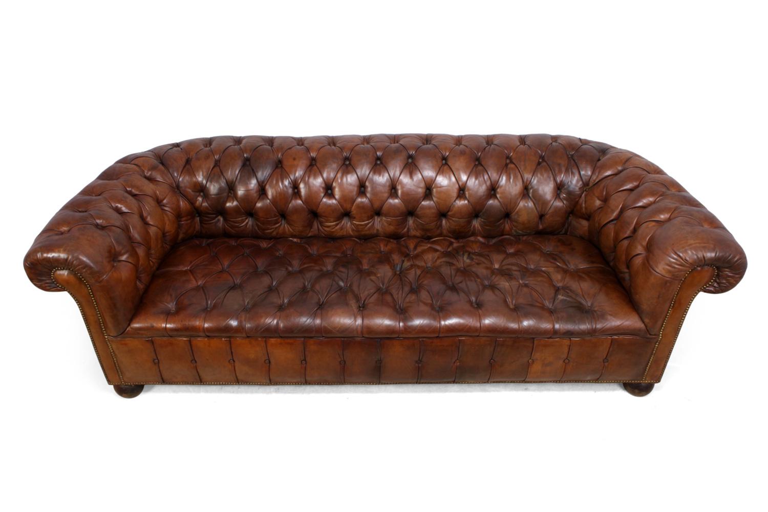 1930s English leather Chesterfield
A buttoned seated hand dyed brown leather chesterfield produced in the 1930s with solid frame, coil sprung, horse hair stuffed, bun feet

the springs have been re seated with new webbing in place all buttons are