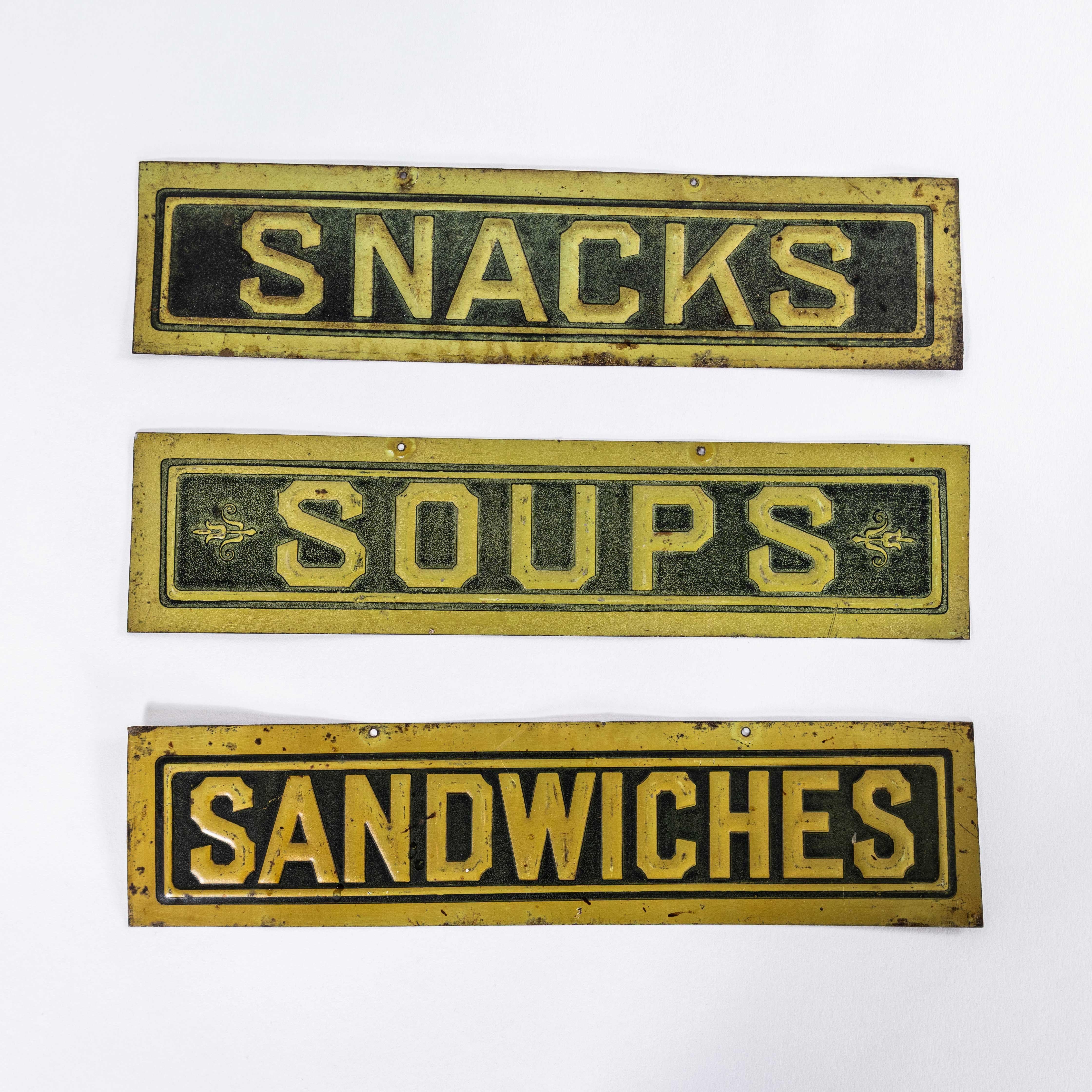 1930’s English Pressed Steel Café Signs – Set Of Three. 
One of the best things we have found this year. 100% original surviving metal signs from the 1930’s. Pressed steel with the original paint. Listing is for the set of three signs.

Workshop