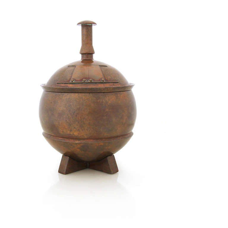 An Arts & Crafts heavy lidded urn of solid bronze.