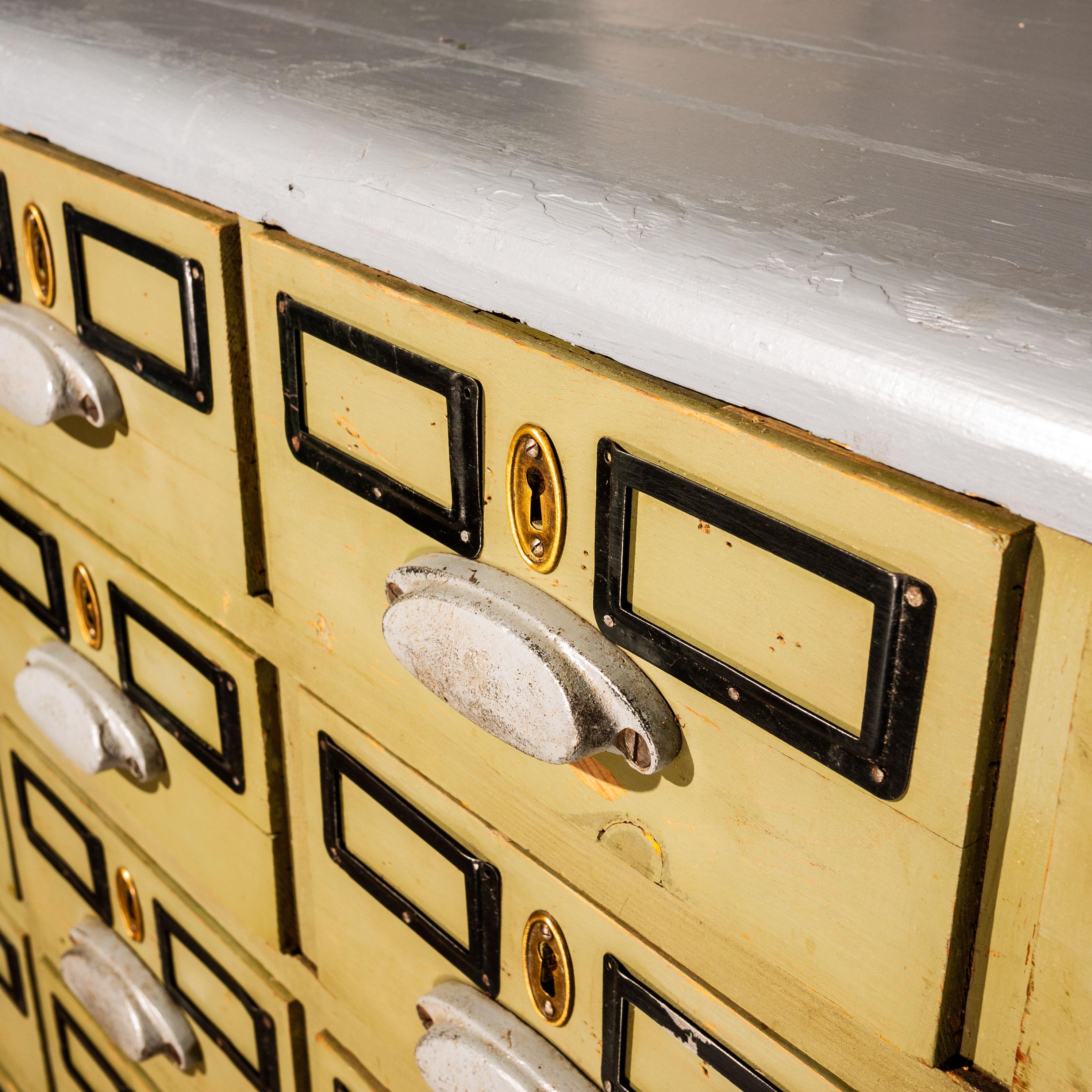 1930s exceptional vintage Russian jewellers cabinet. This forty eight drawer cabinet has survived tucked away in the corner of a jewellery workshop in Western Russia. Made from pitch pine with a two-tone painted finish the cabinet has all 48 of its