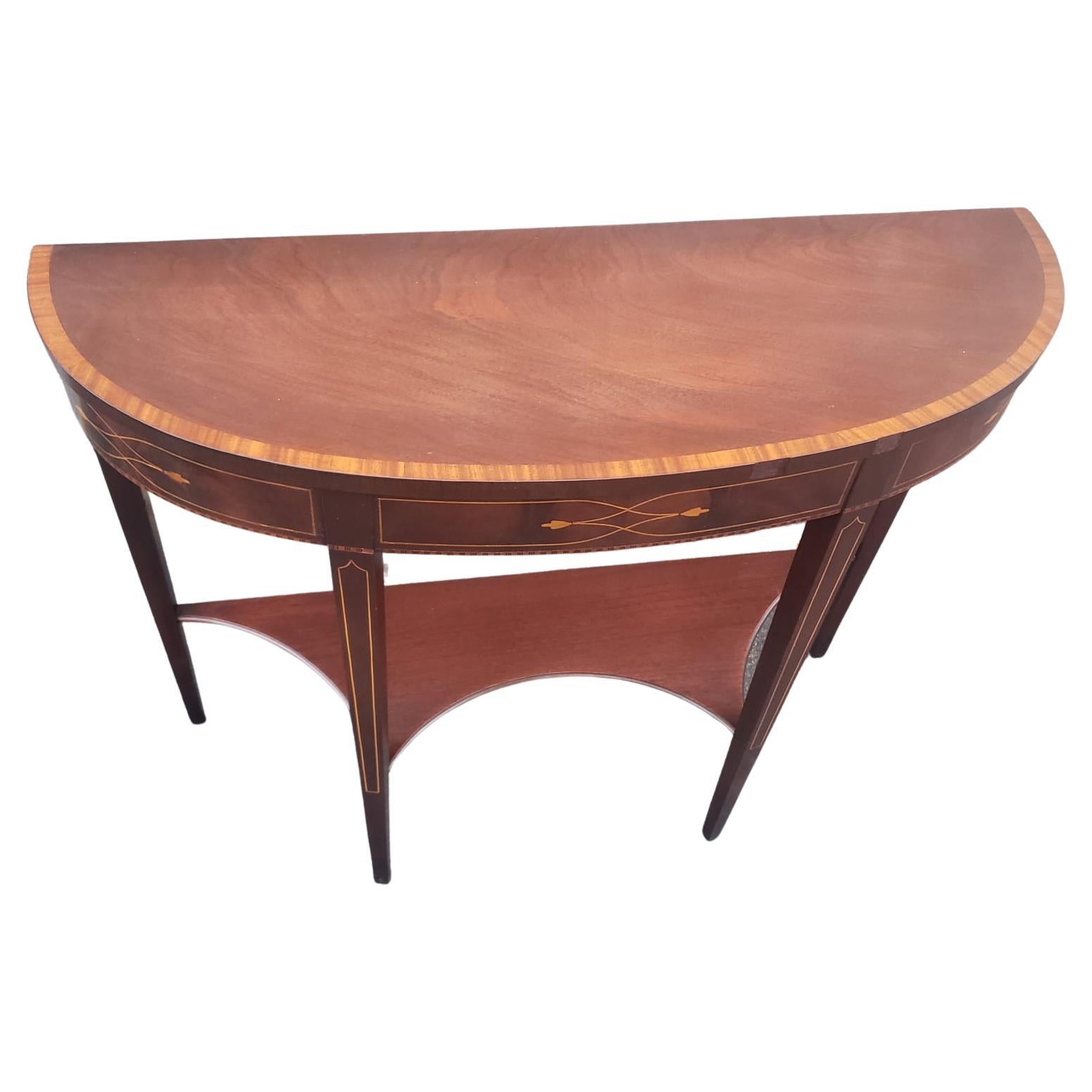 A 1930s Weiman Furniture Heirloom Quality Federal Two-Tier Mahogany and Satinwood Inlaid Demilune Console Table in good vintage condition. Measures 38