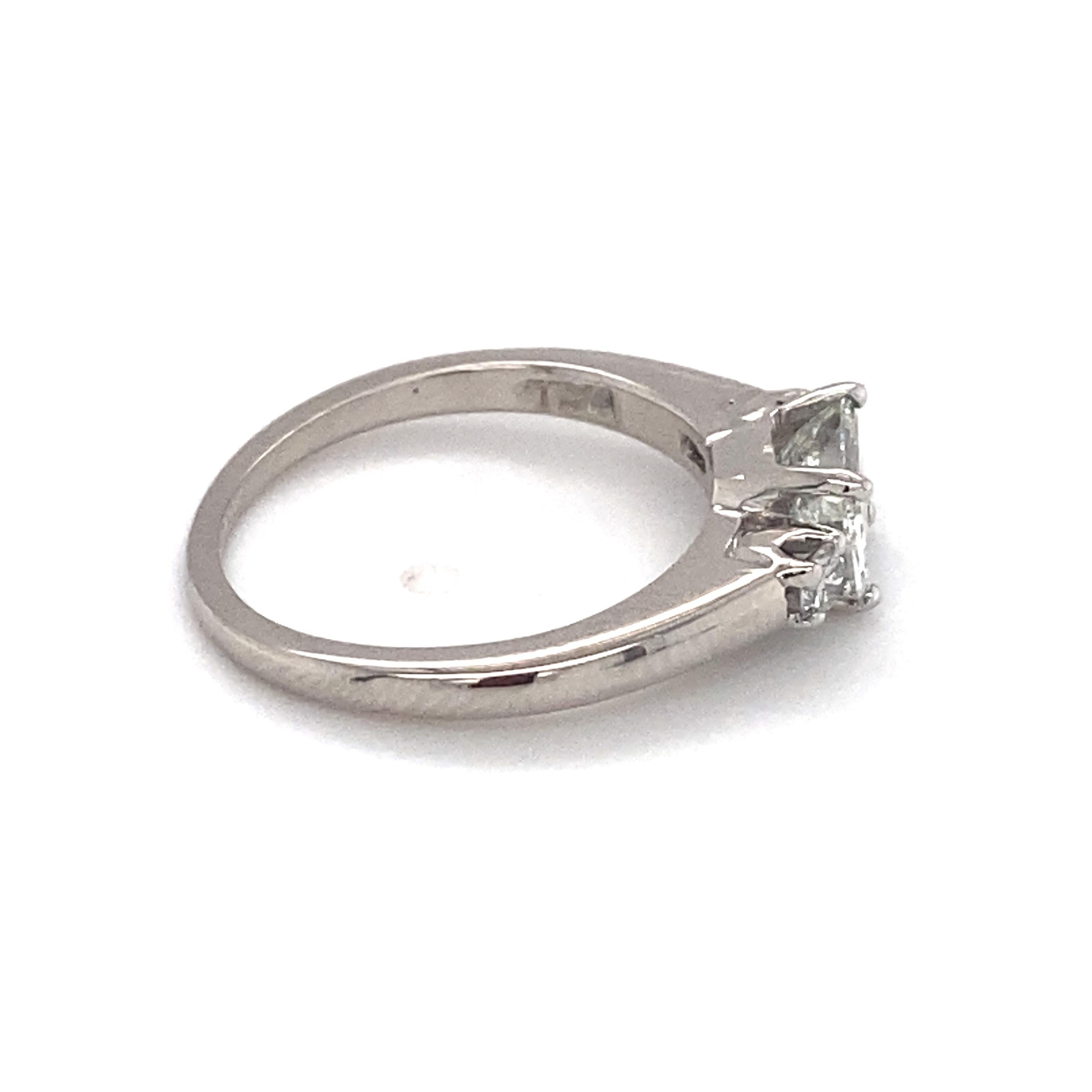 Circa: 1930
Metal Type: Palladium 
Weight: 2.37 grams 
Size: US 4, resizable

Diamond Details:
Carat: 0.60 carats
Shape: Emerald cut
Color: F
Clarity: VS

Additional Diamond Details:

Carat: 0.08 carat total weight
Shape: Transitional cut
Color: