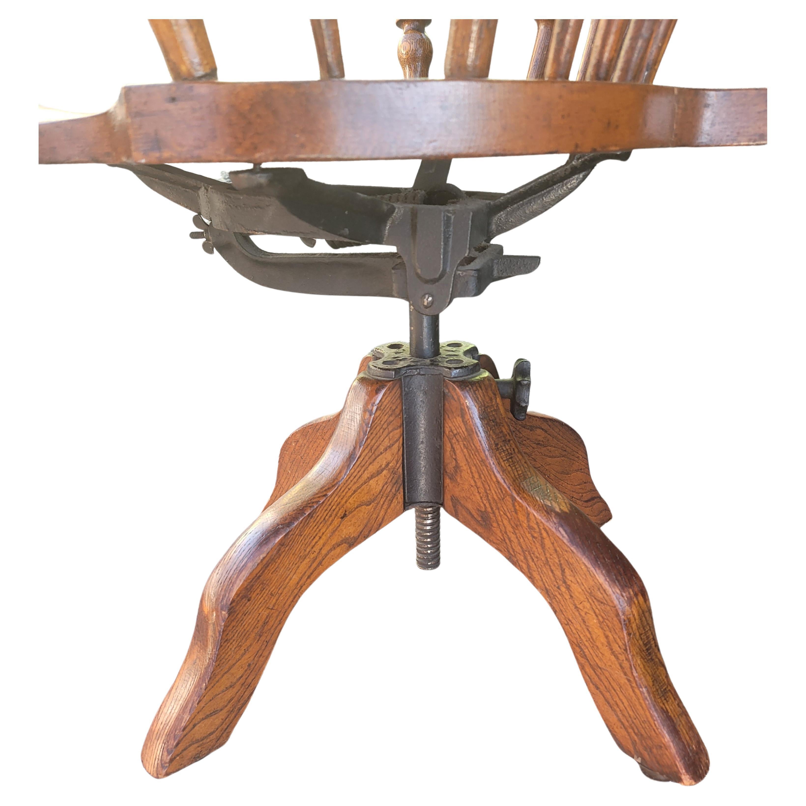Woodwork 1930s Fiddleback Oak Windsor Style Tilting and Rolling Desk Chair W/ Saddle Seat For Sale