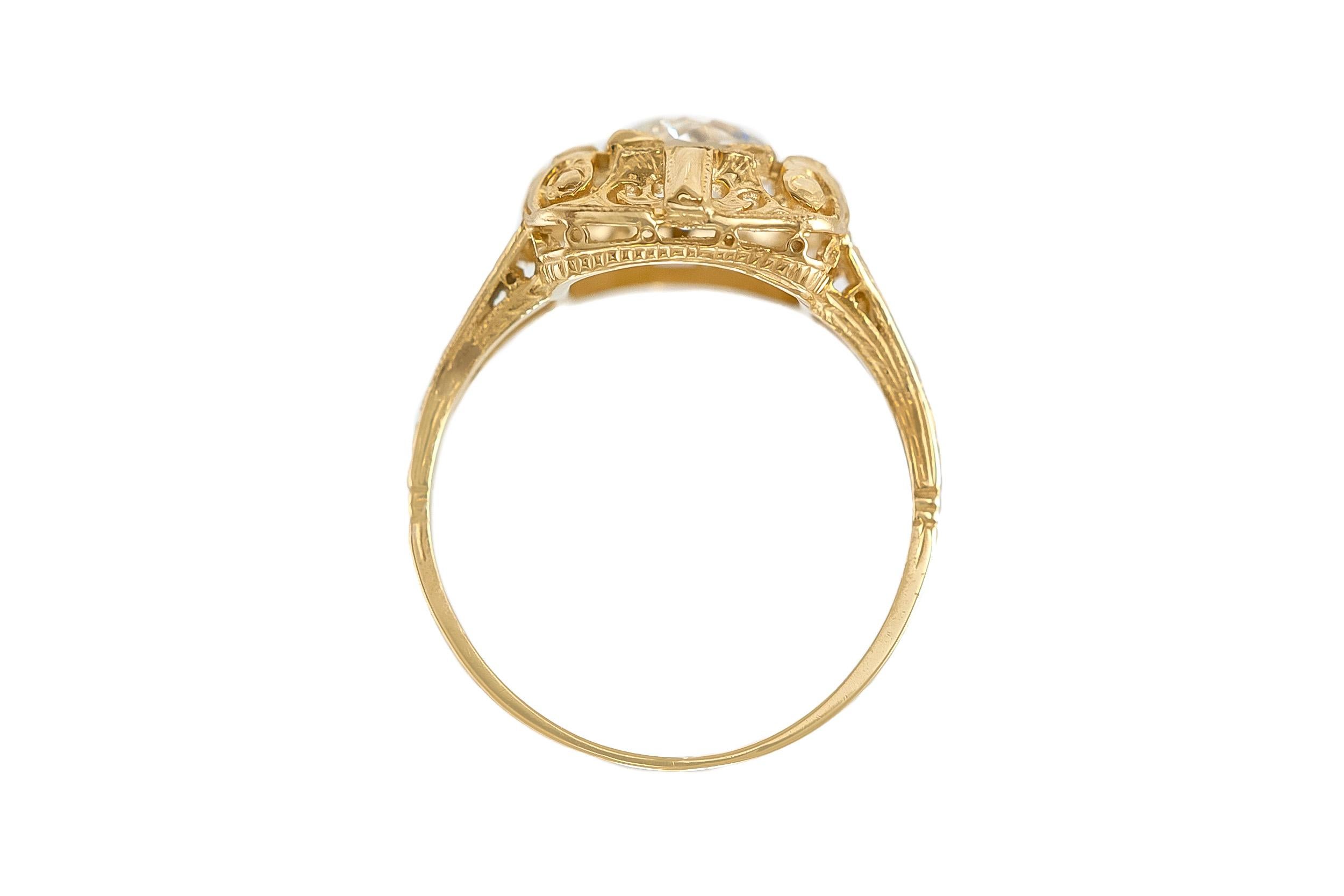 The beautiful ring is finely crafted in 18k yellow gold with center diamonds weighing approximately total of 0.94 carat.
Circa 1930's.
Easy to resize.