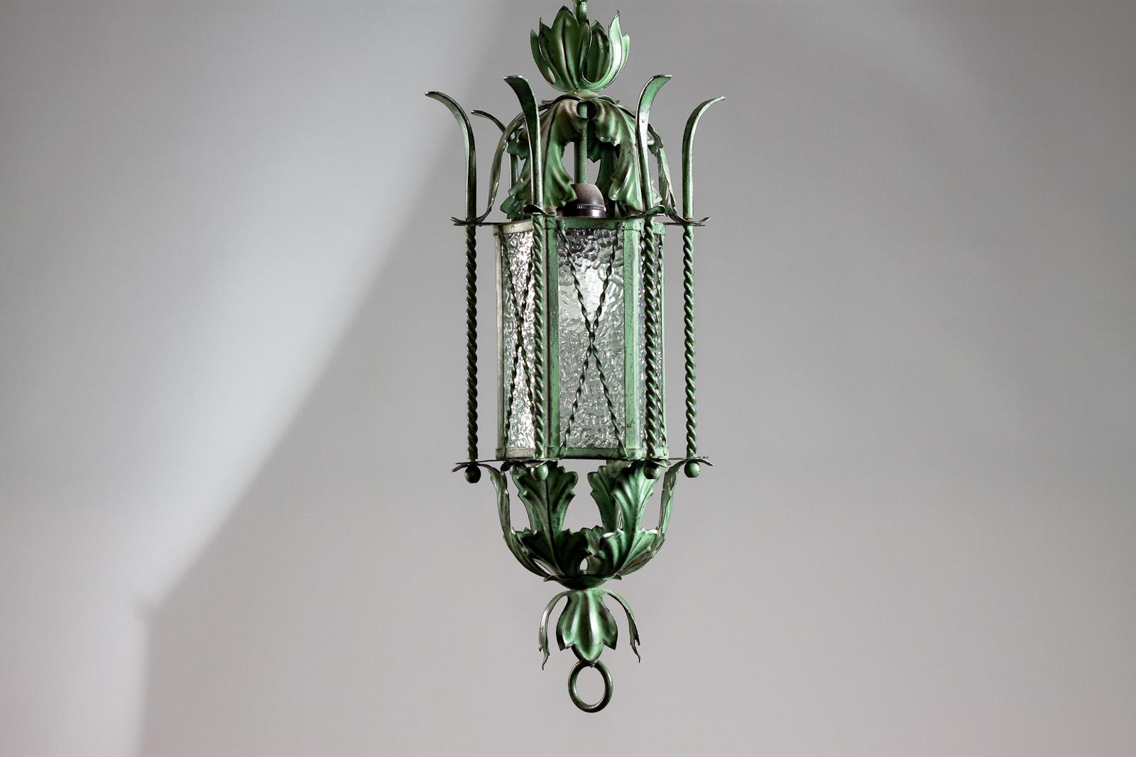 This 1930's Finnish wrought iron lantern light is a rare and striking piece, perfect for lovers of vintage lighting. The patinated decorative detailing gives it an old-world charm, lending a touch of elegance to any space. This piece is attributed