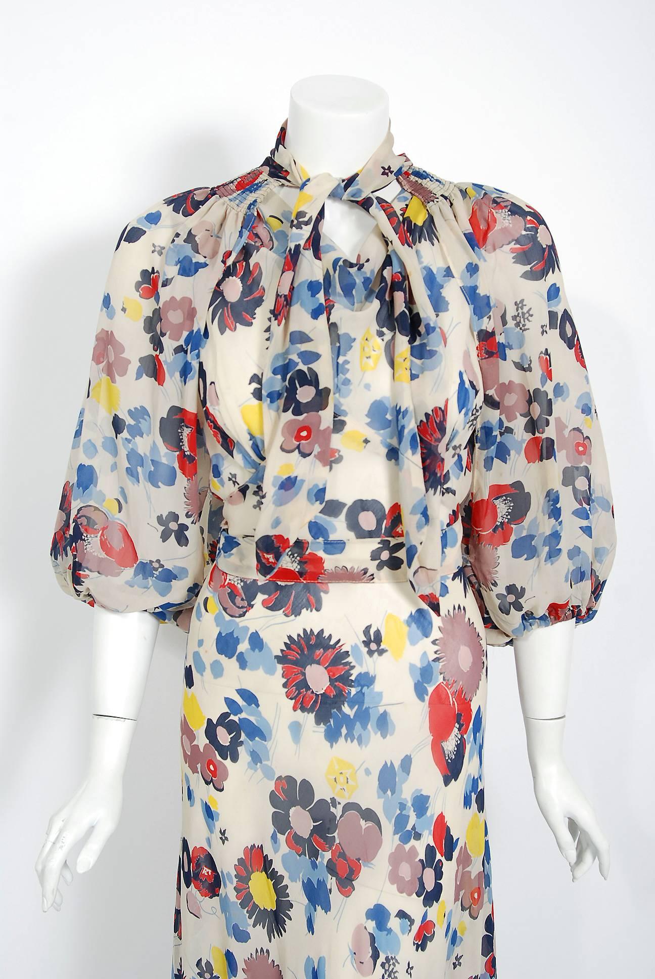 The breathtaking floral garden deco print used on this 1930's semi-sheer silk chiffon gown ensemble has a fresh innocence that I find irresistible. The bodice is a low plunge cowl-neck sleeveless. The belted nipped waist falls into an hourglass