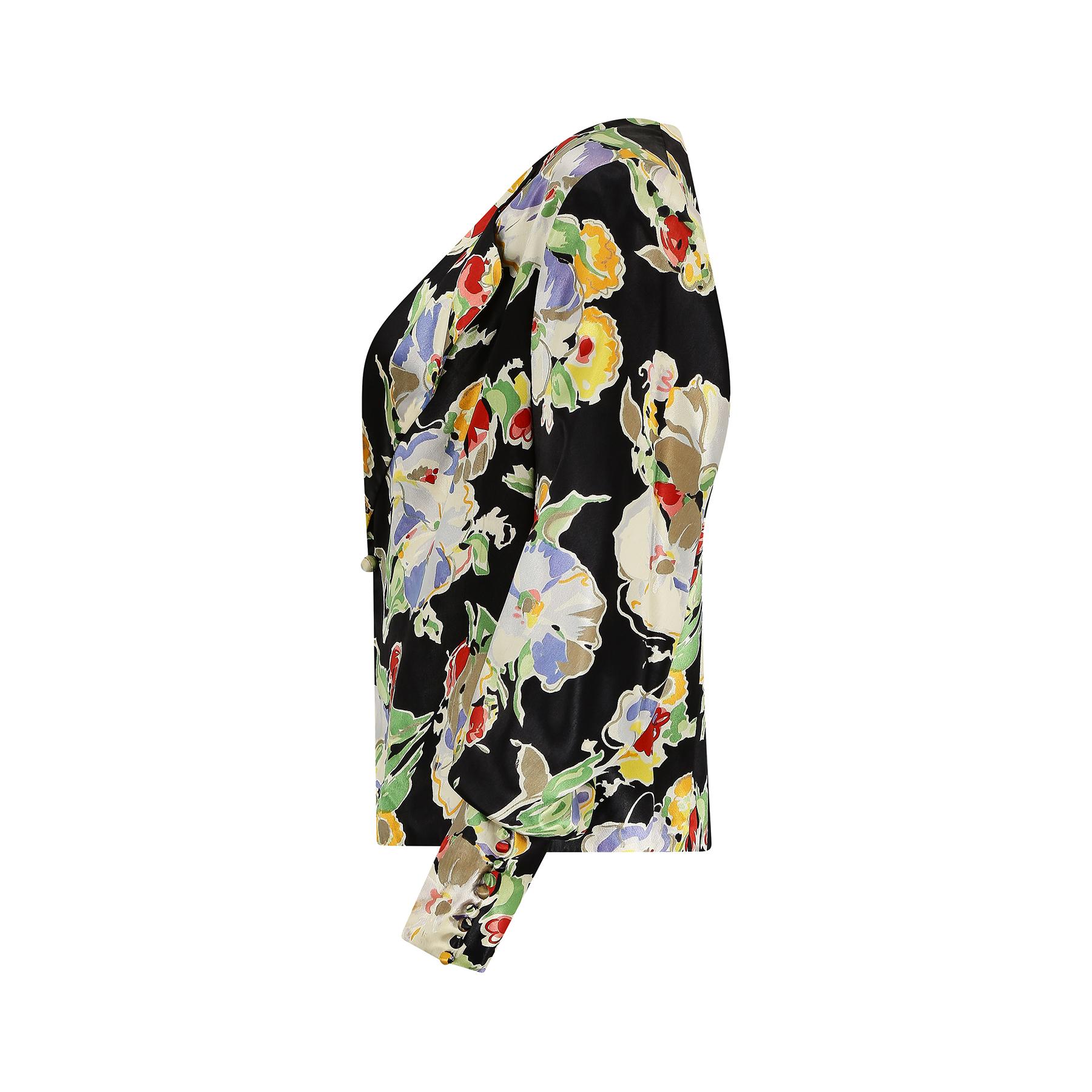 This is a really good 1930s jacket when floral satin fabrics were the height of fashion and sophistication for dinner and cocktail-wear. This has a really excellent print made up of a floral spray of what looks like irises and roses amongst others.