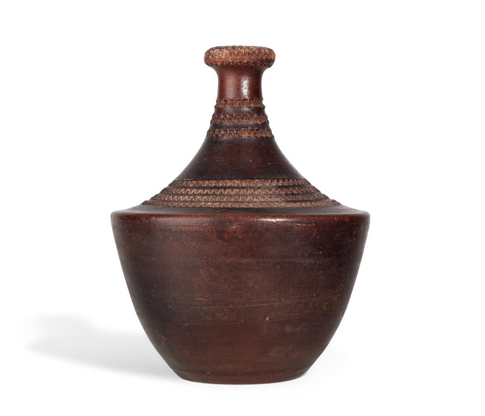 1930s ancient-inspired Art Déco folk ceramic vase with incised decorative patterns by Jean Besnard, France

By: Jean Besnard
Material: ceramic, clay
Technique: cast, pressed, hand-crafted, hand-carved, carved, glazed
Dimensions: 6.5 in x 8.5