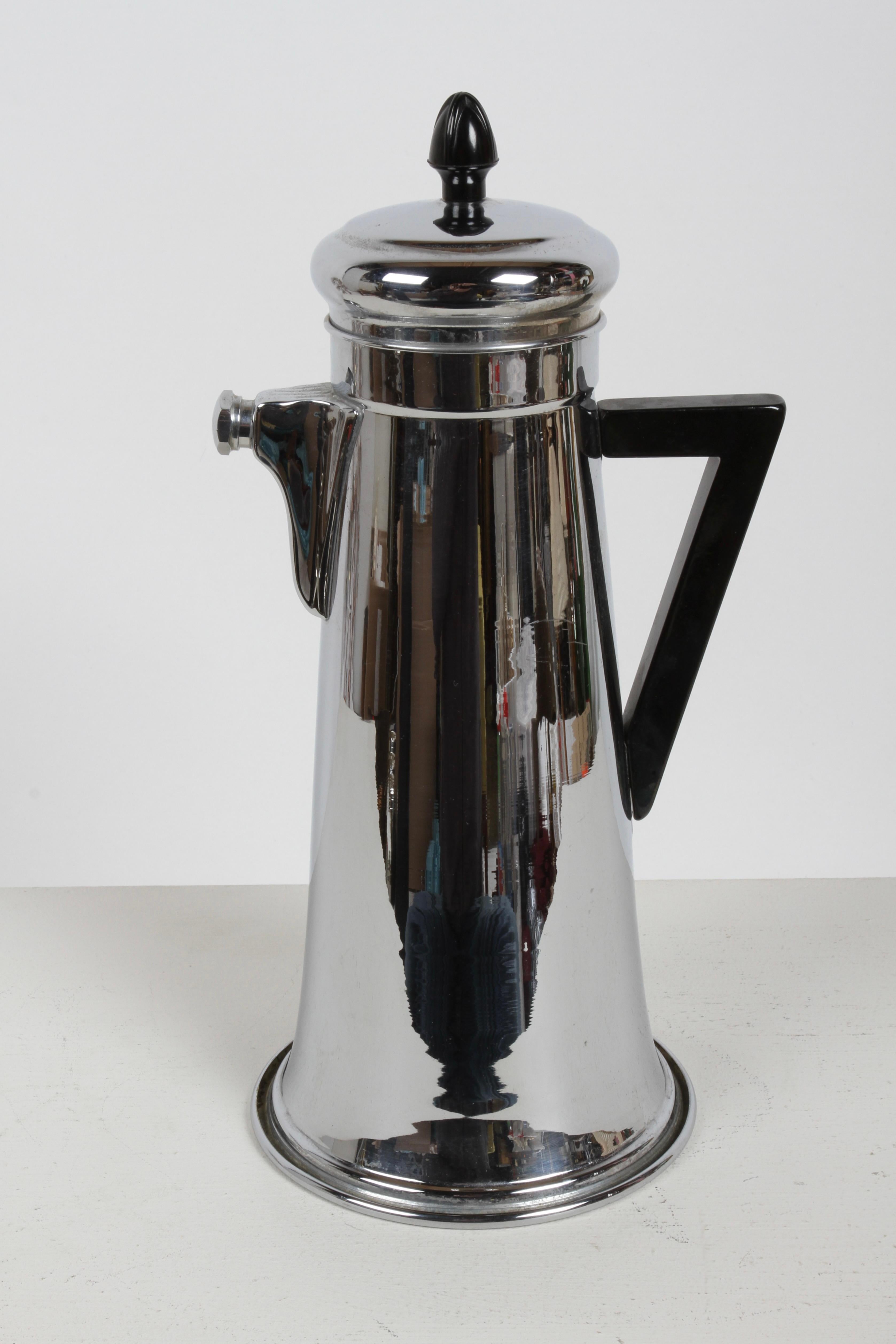  1930s vintage Art Deco Forman Brothers chrome cocktail recipe shaker,  with angular black handle & finial, possibly bakelite. Hidden on the bottom of this shaker are 14 cocktail recipes. This patented Art Deco design features a strainer built into