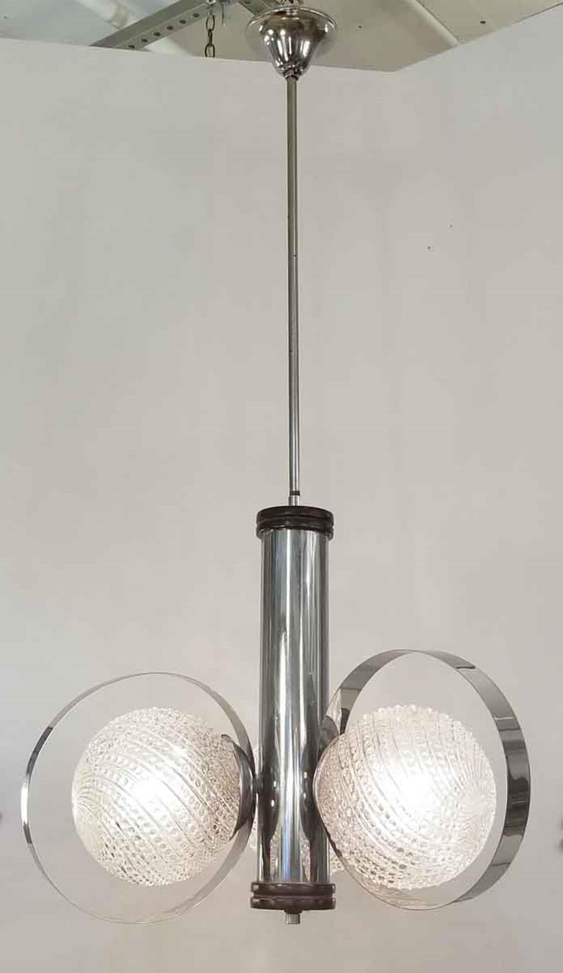 This is a 1930s French deco chandelier consisting of three textured beaded sphere globes each encircled with a chrome strip. The main stem is chrome with wood at the top and bottom. Imported from Belgium. Price includes restoration. Please allow 1-2
