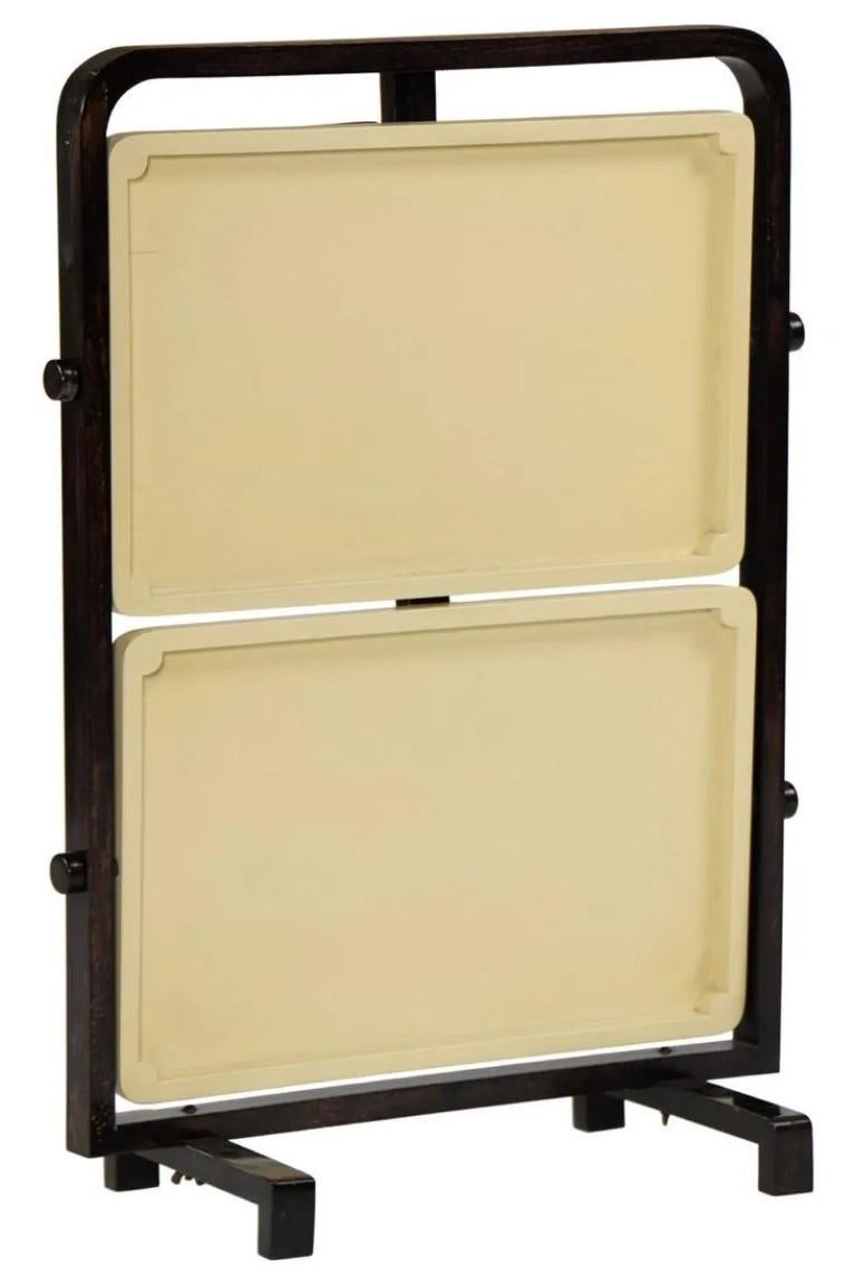 1930s French Art Deco carrying table by André Groult. Two (2) beige trays in black wooden frame, movable and collapsible. Restoration done by others, very typical furniture from the period.