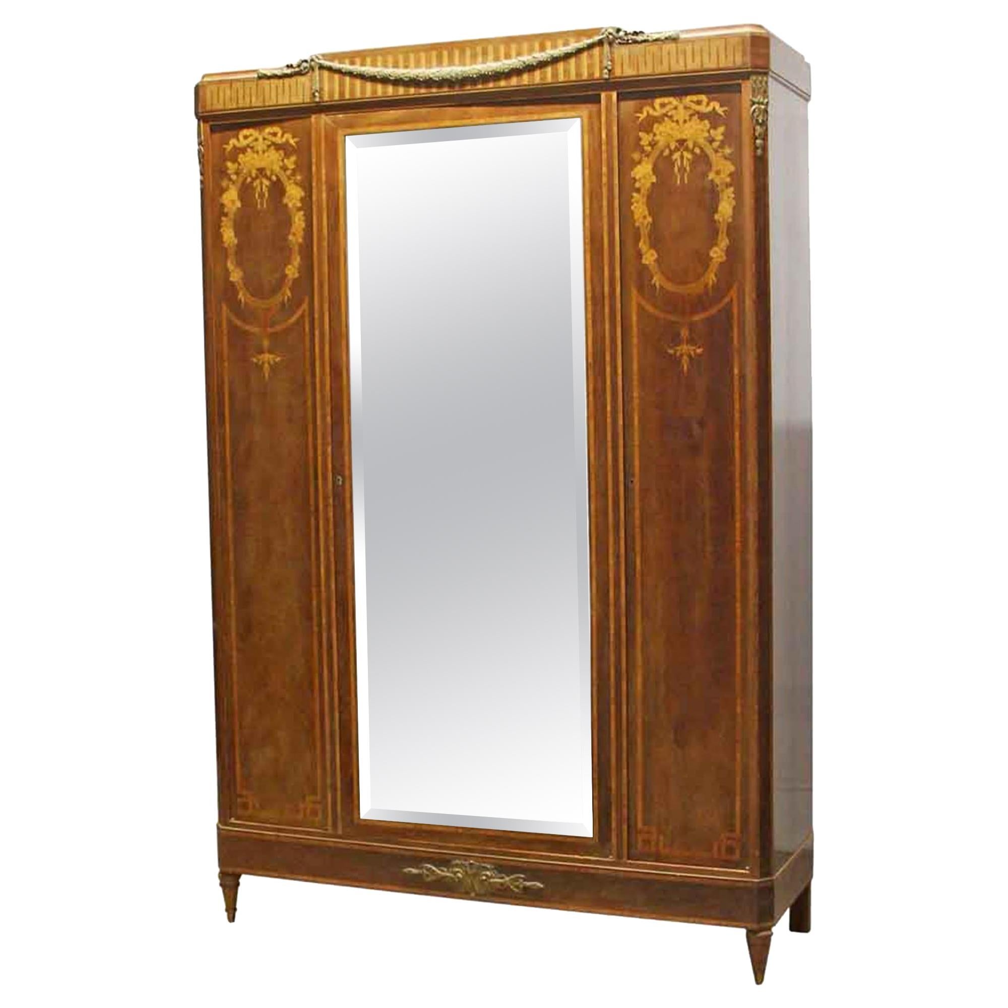 1930s French Art Deco Carved Walnut Mirrored Armoire with Detailed Inlays