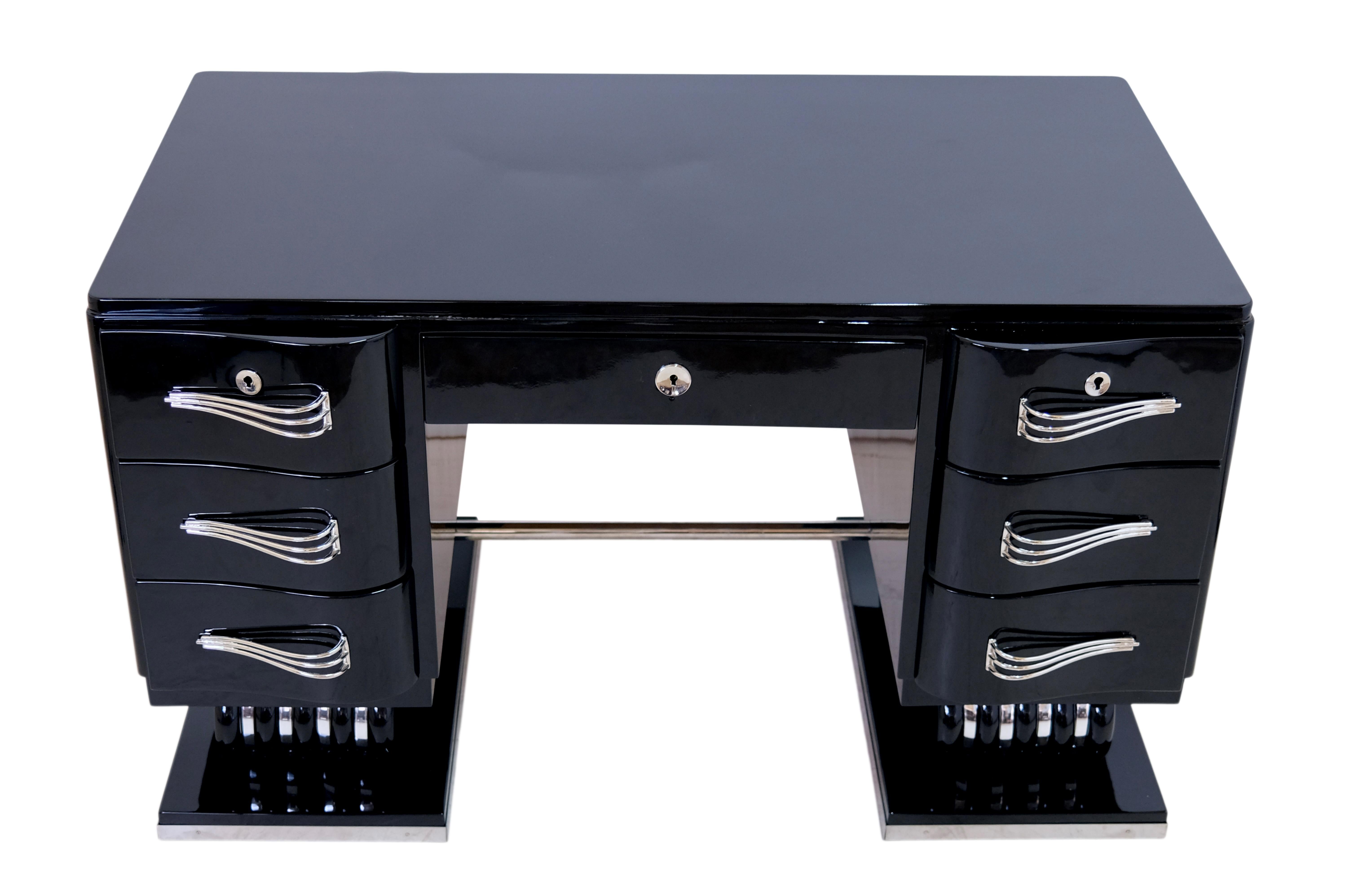 Desk
Piano lacquer, black high gloss
Metal applications, freshly nickel-plated
Non-functional drawers on the back

Original Art Deco, France 1930s

Dimensions:
Width: 130 cm
Height: 79 cm
Depth: 80 cm
Working depth: 69 cm