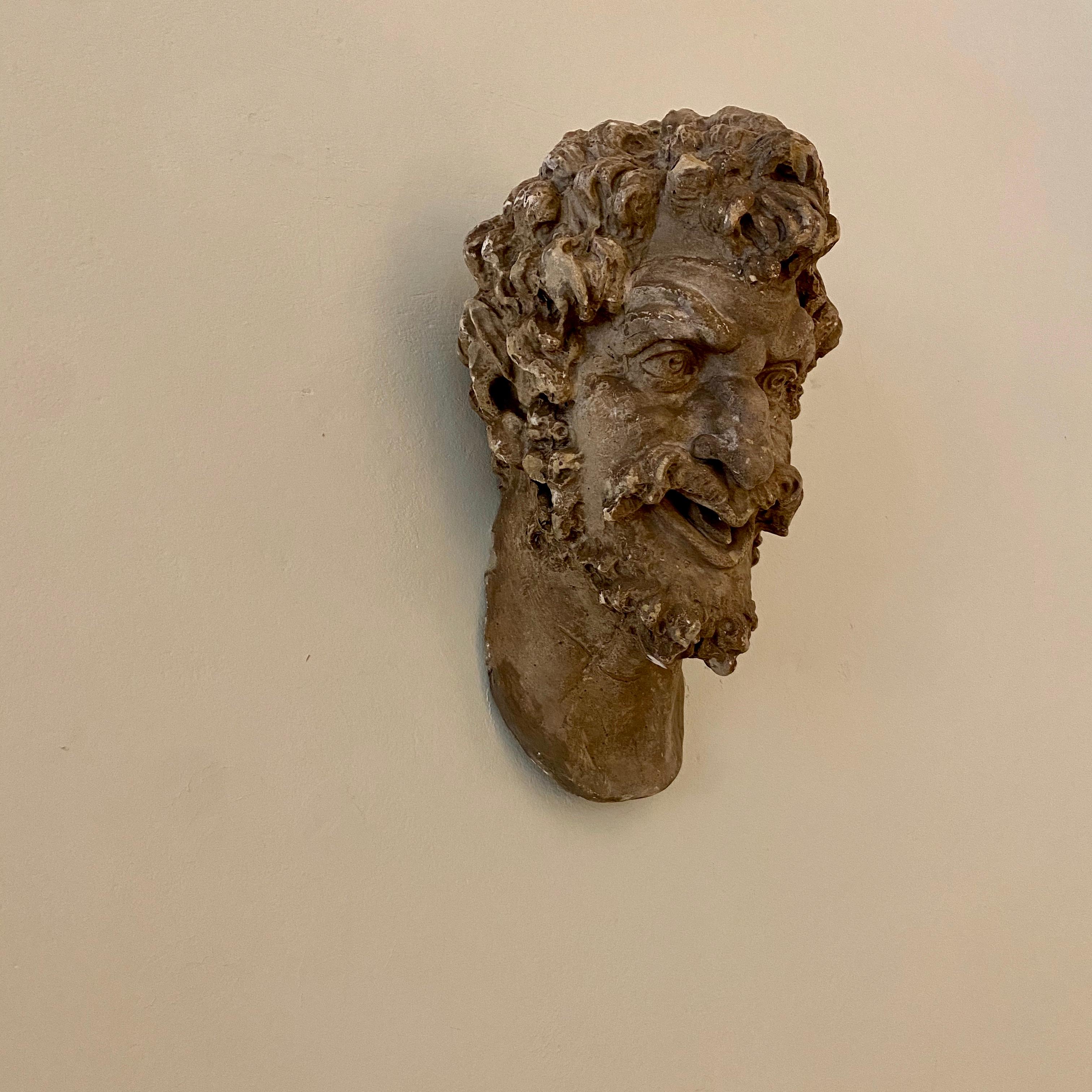 This Huge 1930s French Art Deco plaster head of a satyr has got a beautiful patina and is in its original condition.
A unique piece which is a great eye-catcher for your antique, modern, Space Age or midcentury interior.
   
All pieces are looked
