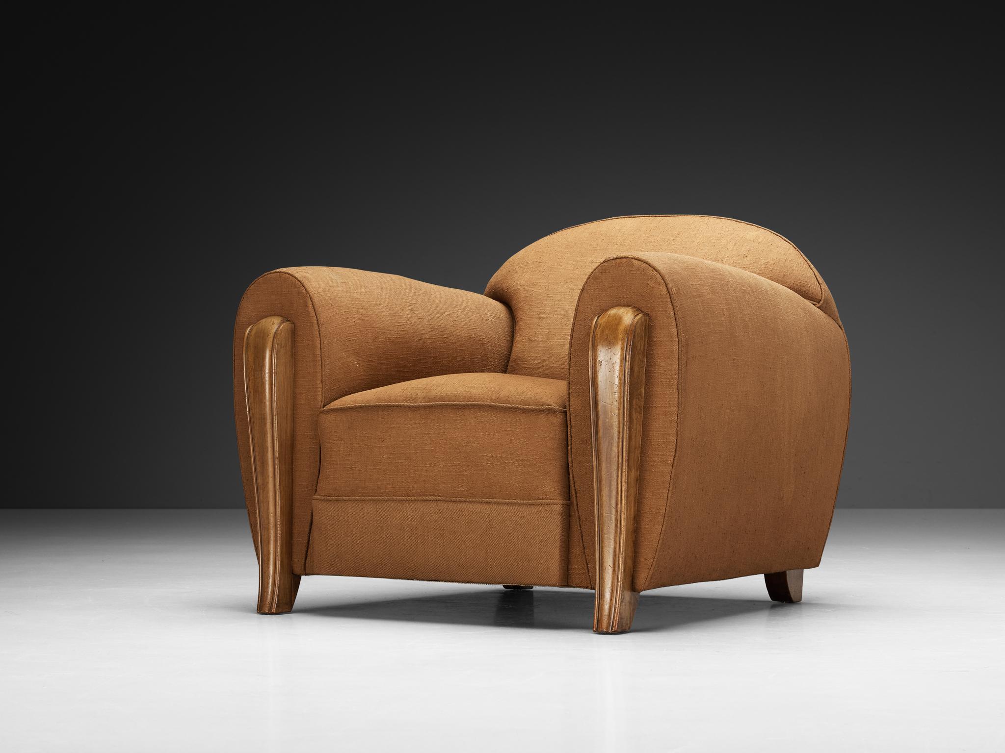 Armchair, fabric, walnut, France, 1930s

A beautiful example of Art Deco design from the 1930s, originating from France. This design is dominated by graceful curves and substantial forms. The chair's armrests, a defining feature, are noted for their