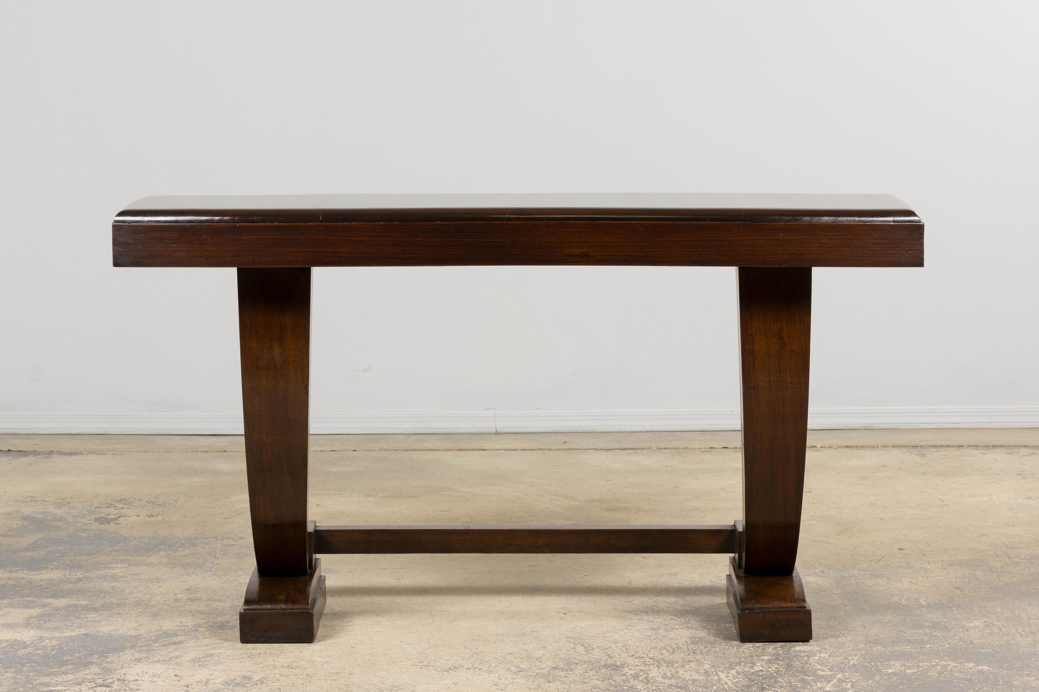 Sourced in Provence, this French Art Deco console table reflects the refined modernism of the 1930s–40s period. Crafted in mahogany, the piece showcases a rich, warm finish with subtle natural grain. We have structurally revised and fully refinished