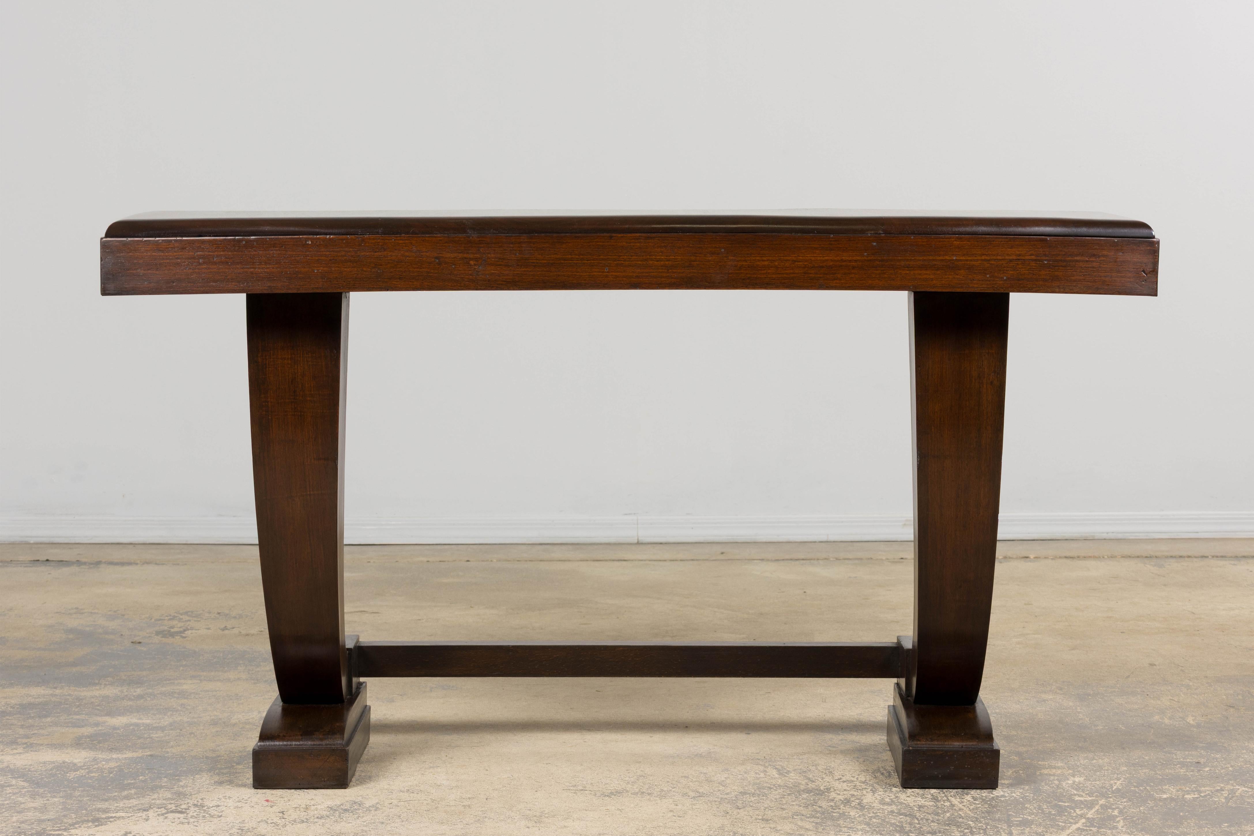 Sourced in Provence, this French Art Deco console table reflects the refined modernism of the 1930s–40s period. Crafted in mahogany, the piece showcases a rich, warm finish with subtle natural grain. We have structurally revised and fully refinished