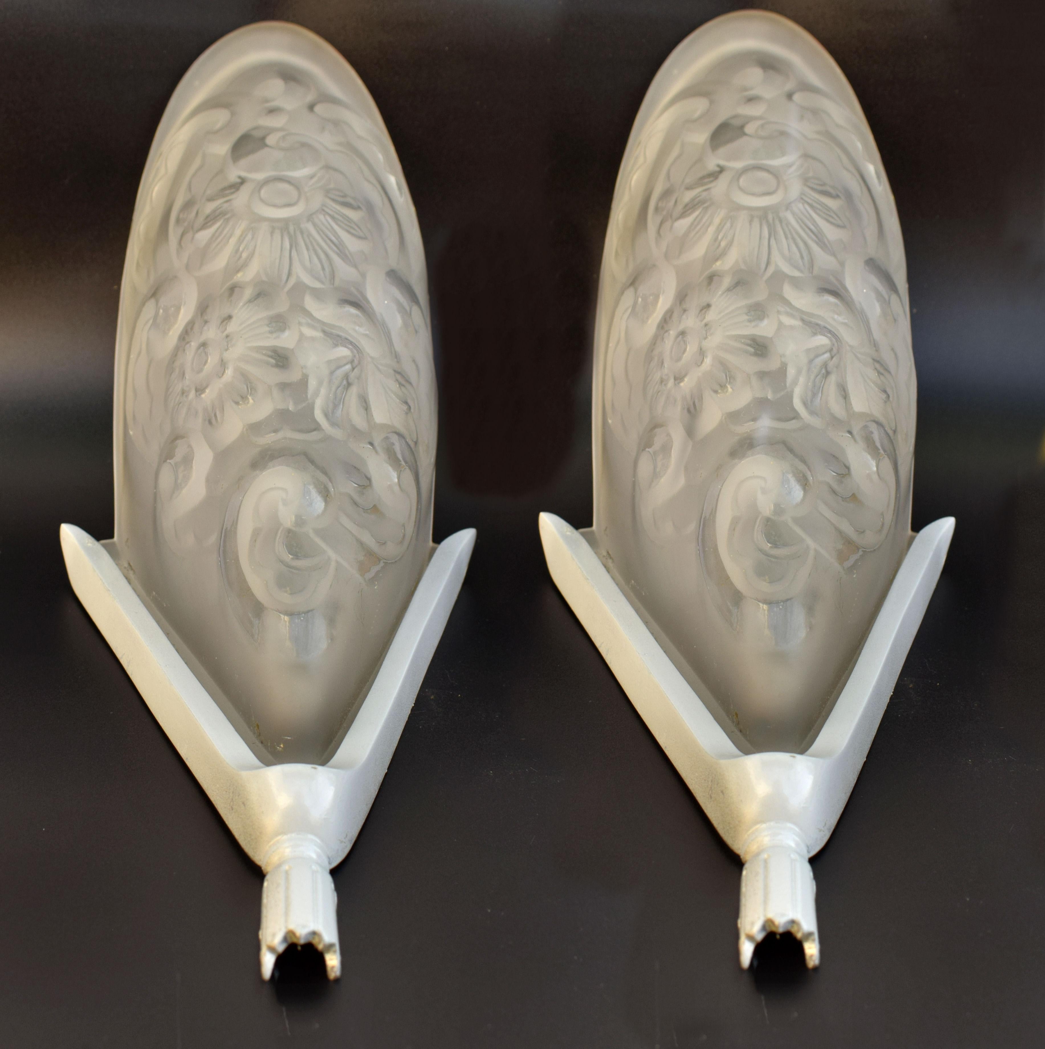 We really can't sing the praises of these fabulously stylish Art Deco sconces enough. Originating from France these Art Deco matching pair of wall light sconces feature very heavy thick satin pressed glass slip shades which sit snugly inside heavy