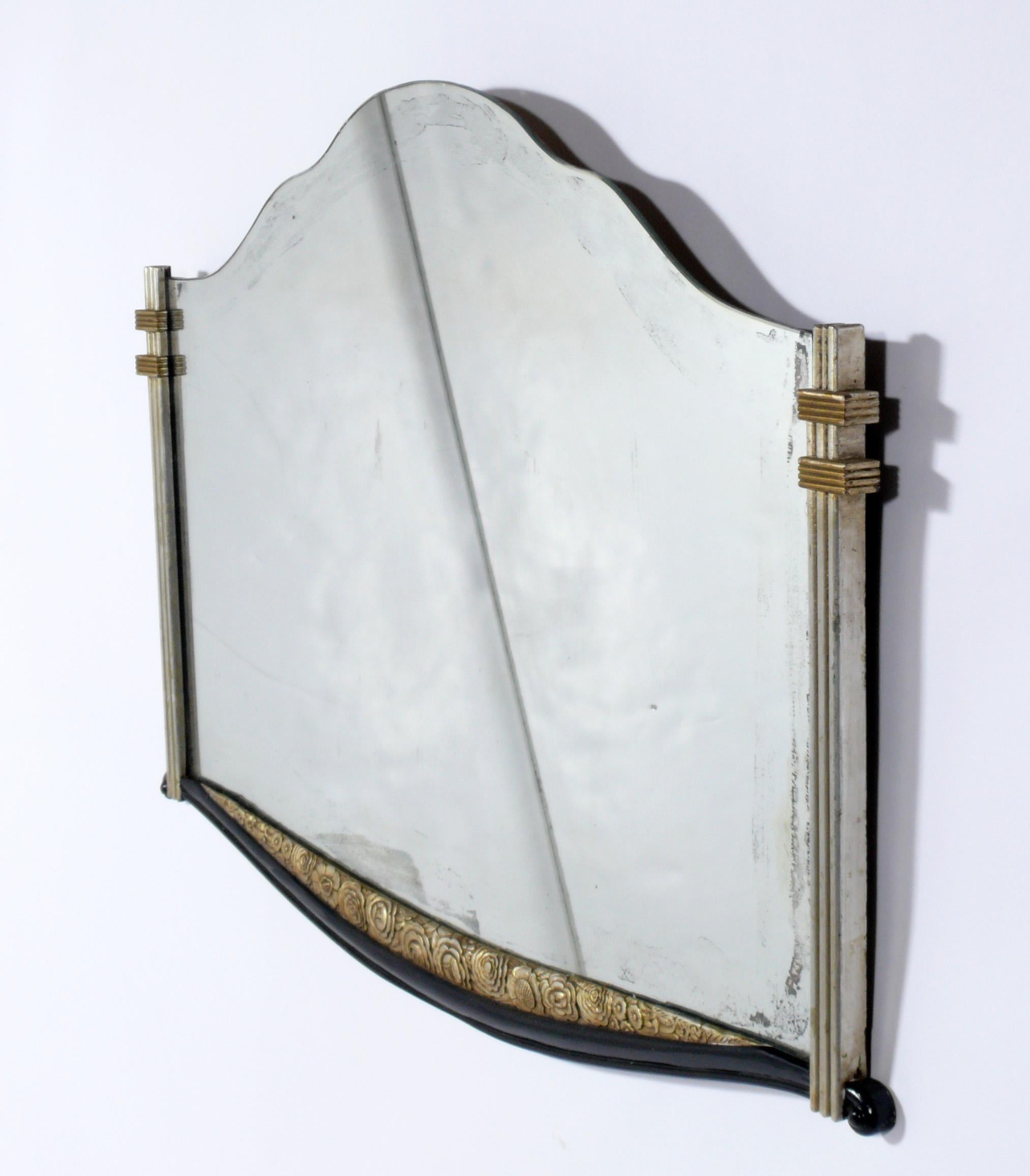 Elegant French Art Deco mirror, France, circa 1930s. Retains wonderful original patina to both the original mirror and the parcel gilt frame.