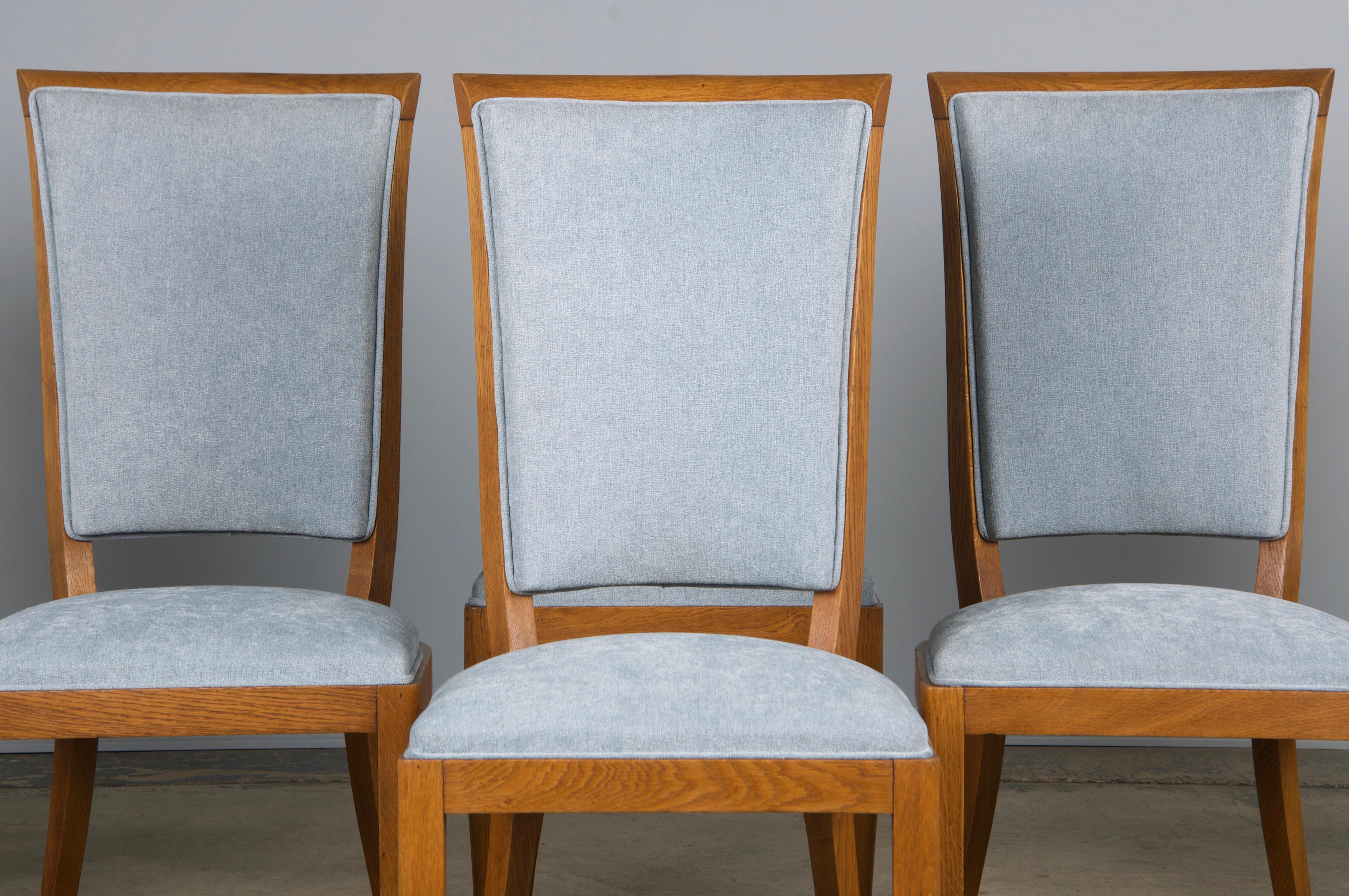 A classic set of six 1930s French Art Deco dining chairs, sourced from Provence, France. Expertly handcrafted from solid oak, each chair features a beautifully aged patina in a rich, warm brown tone. Structurally restored and newly reupholstered in