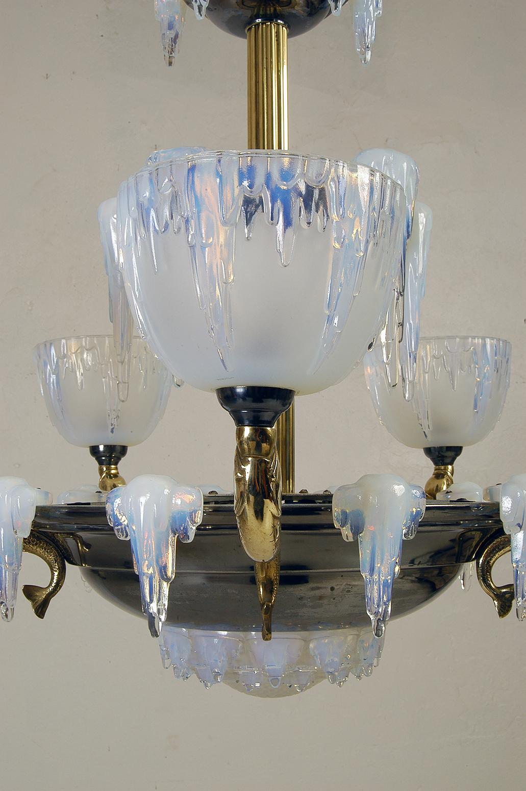 Magnificent 1930s French High Art Deco ‘Icicle’ chandelier by Henri Petitot, Lyon France. The spectacular opalescent glasswork is by Ezan, Paris.
From the central polished reeded brass stem hang three graduated nickel plated brass tiers. From the