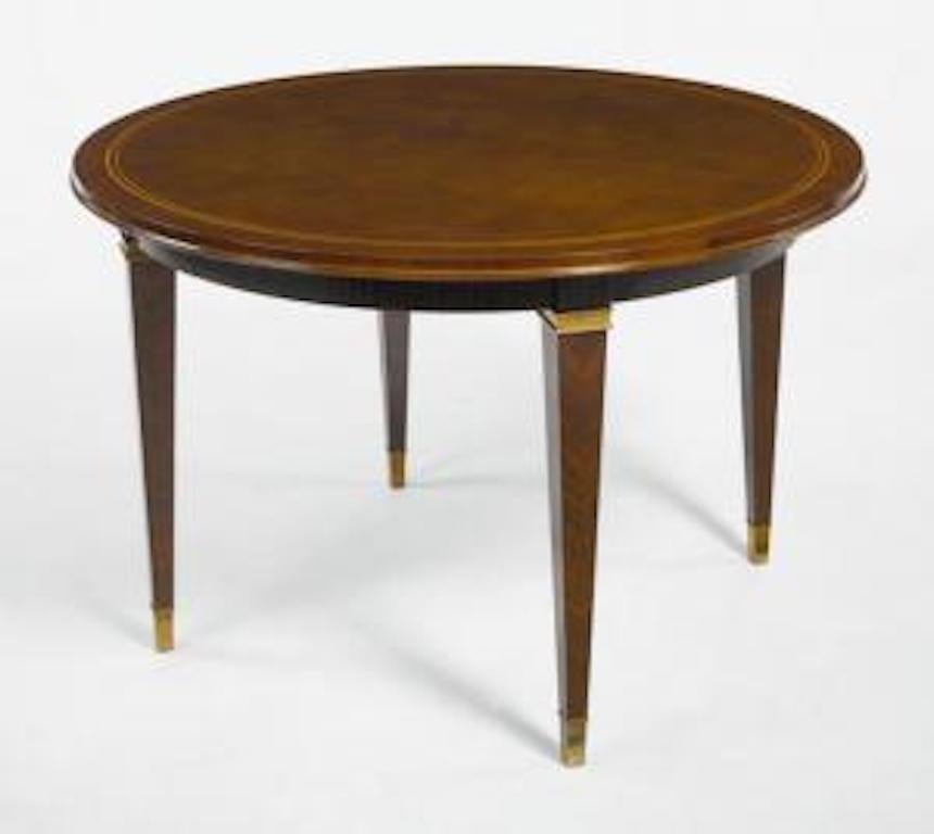French Art Deco (1930s) round dining table with a brown lacquered top (by Atelier Sain et Tambut√©, Paris) over 4 tapered Macassar wood legs with bronze trim (by DOMINIQUE)
