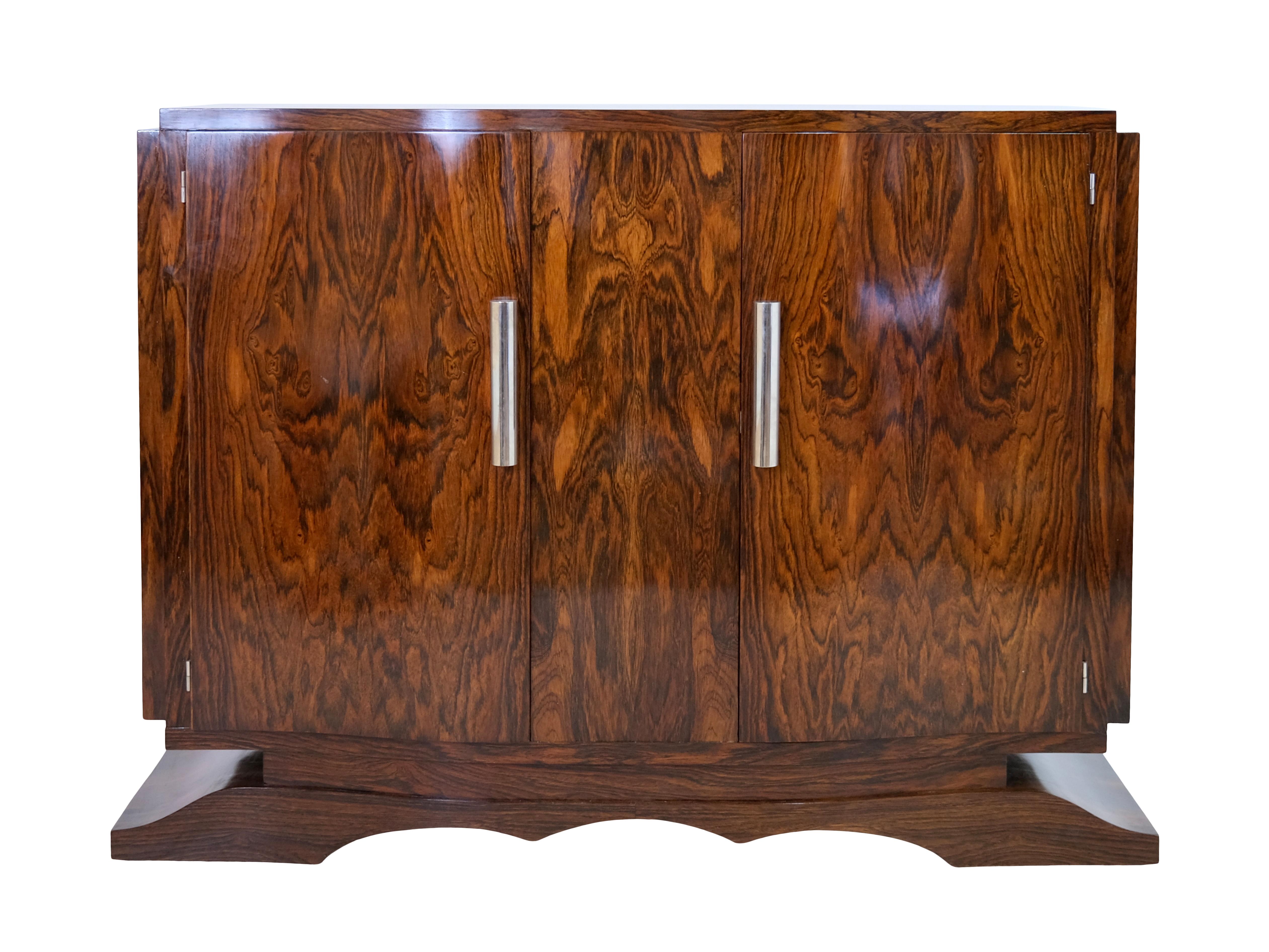 Sideboard
Caucasian nutwood, shellac hand polished
Cylindrical fittings with sliding mechanism to cover the keyholes

Original Art Deco, France 1930s

Dimensions:
Width: 127 cm
Height: 97,5 cm
Depth: 43 cm